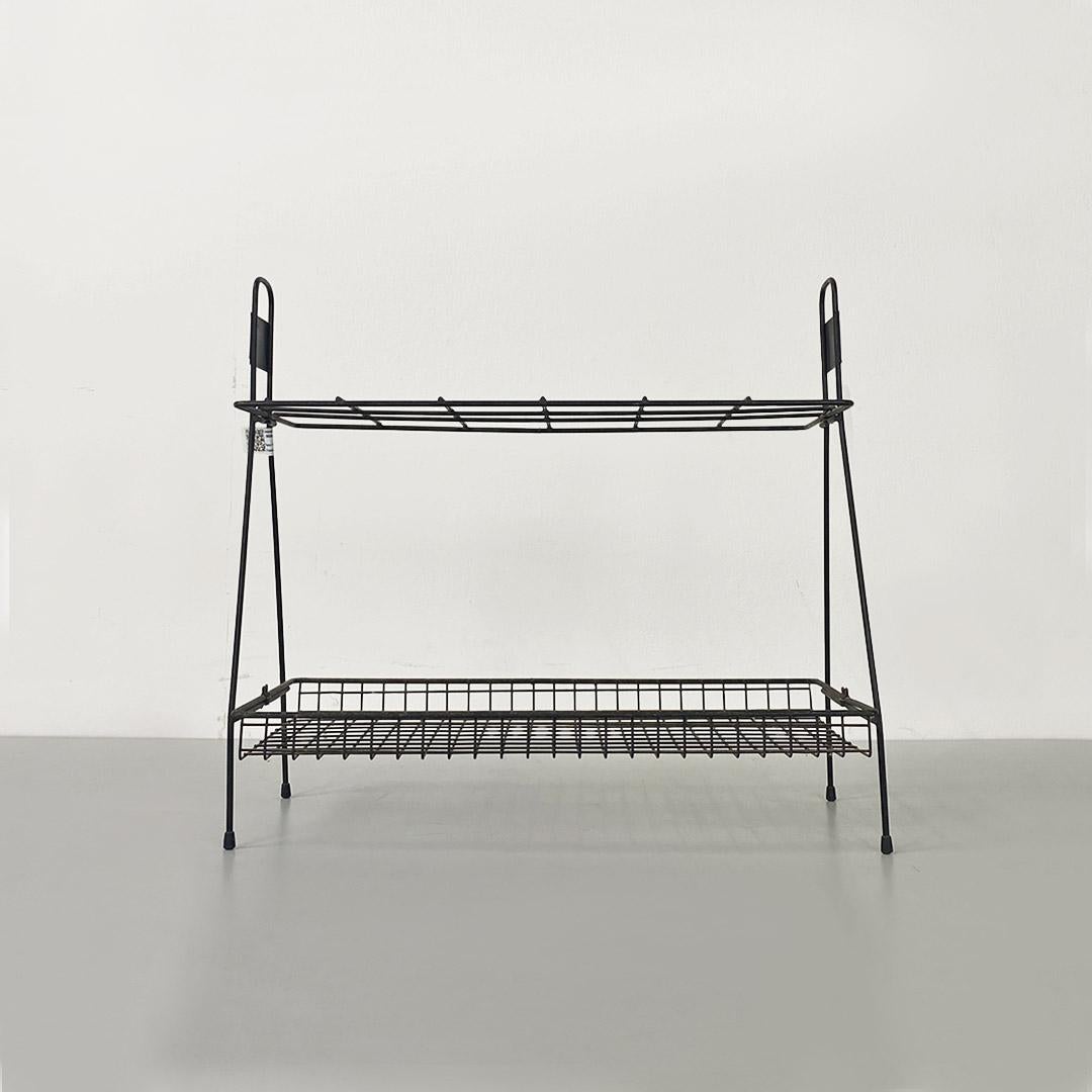 Black painted steel wire umbrella stand with two shelves.
Produced by Solai Varese in about 1950.
Good conditions.
Measures in cm 28x60x50h
Convenient, practical and lightweight umbrella stand, made of black painted steel, with feet, perfect to