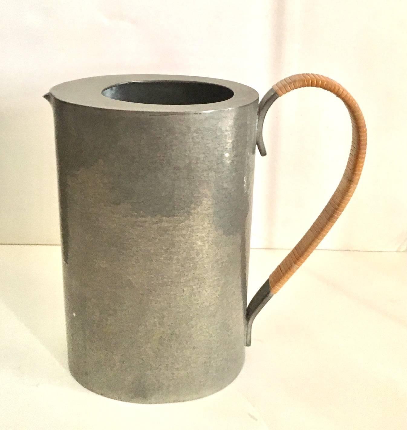 A mid century Porter Blanchard Pewter five-piece hammered  Silver Plated and wicker coffee and tea and pitcher service.
a rare set of the well known Los Angeles designer and manufacturer Porter Blanchard.
Provenance: 20th century furniture and