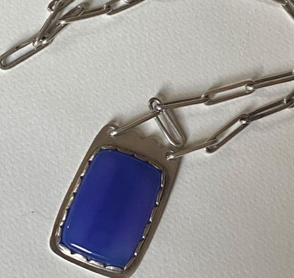 Porter Blanchard Silver Link Necklace with Silver and Blue Chalcedony Pendant

Pendant has concealed MMS Monogram on underside.

Designer: Porter BlanchardMaker: Porter BlanchardDesign #:Circa: 1940'sDimensions: chain L:  17”  pendant: 1 1/16” X 1