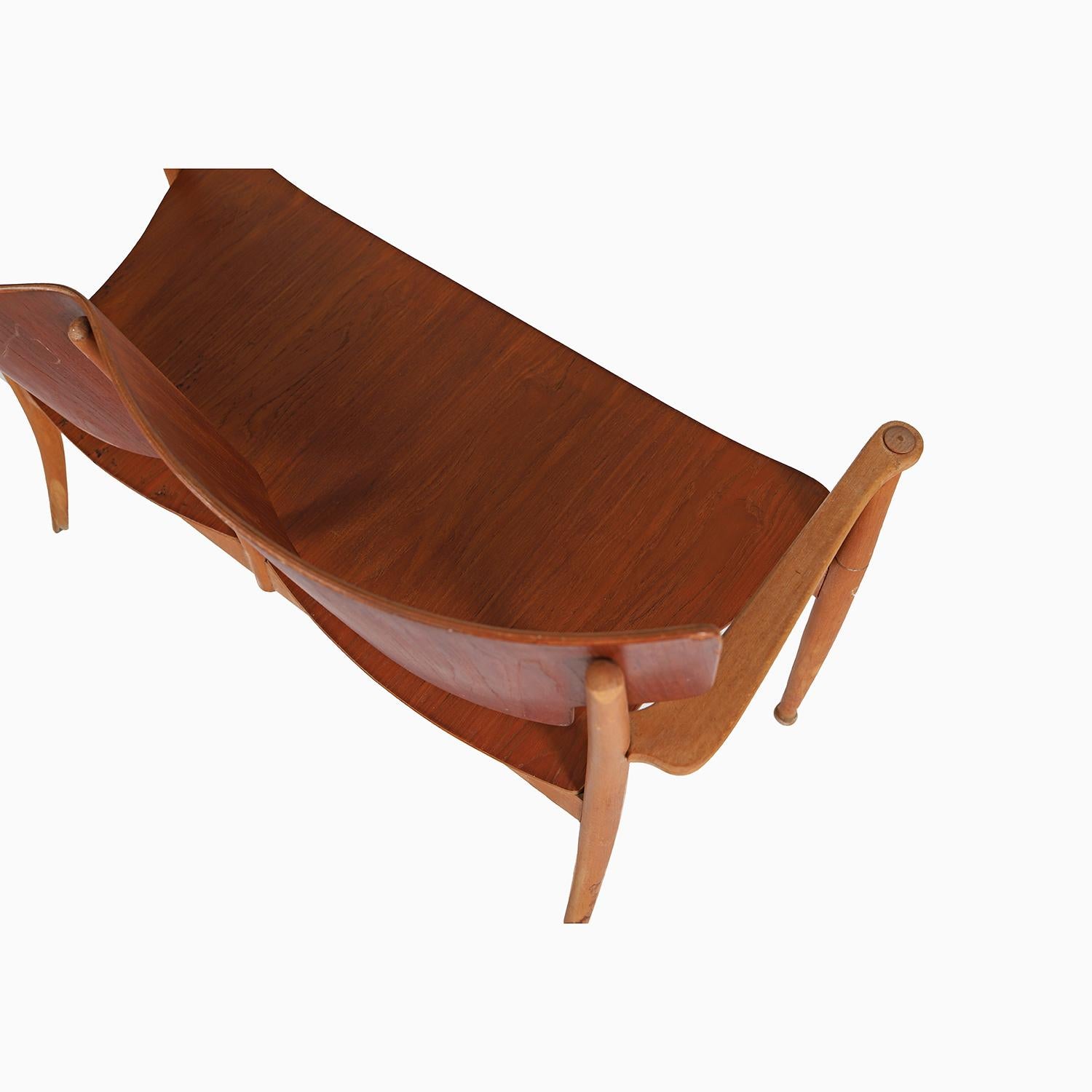 a very rare and curvy settee in laminated teak and beechwood, designed by Peter Hvidt and Orla Molgaard Nielsen in the 1940's.  sold originally by Polexim Copenhagen.  

Professional, skilled furniture restoration is an integral part of what we do