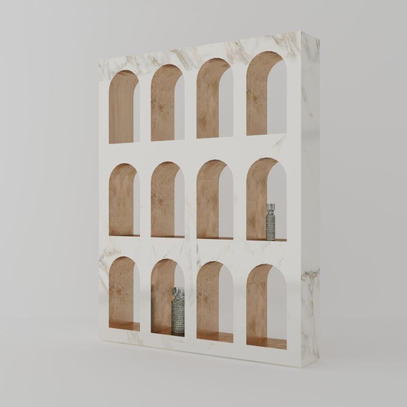 Portici bookcase, Calacatta gold by Sissy Daniele
Dimensions: W 170 x D 30 x H 215 cm
Materials: Calacatta gold, bronze

Also available: Marquinia and Fumigated wooden case packing

Showcasing the elegant veins of marble, the bookcase Portici