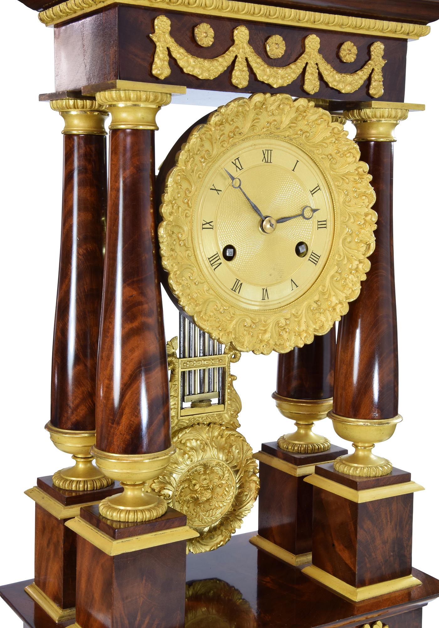 French Portico clock in mahogany and bronze mercury gilding 1840
