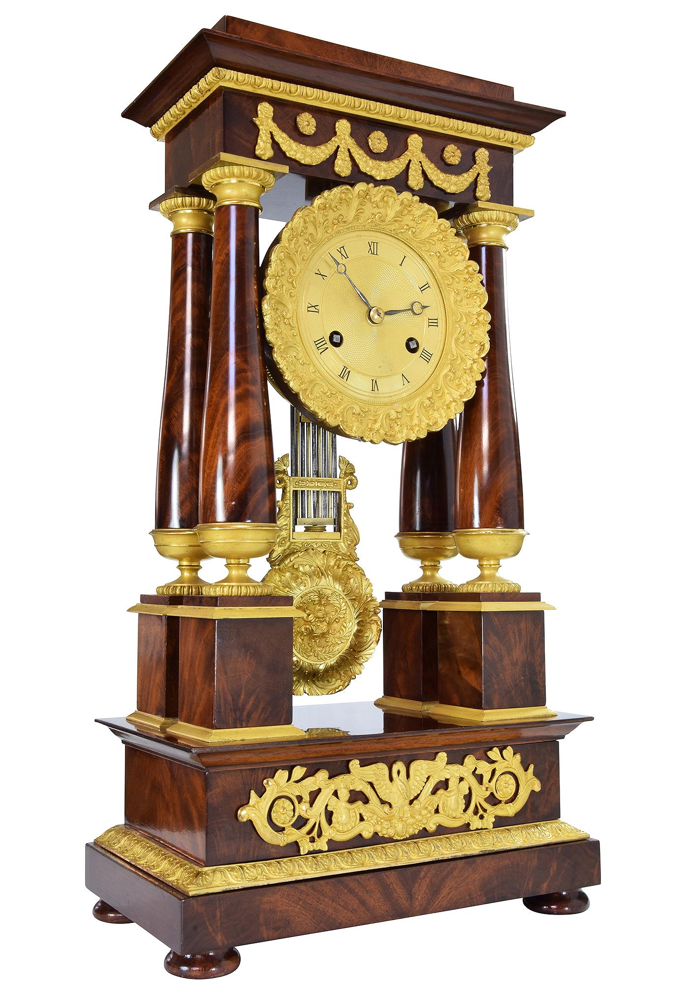 Gilt Portico clock in mahogany and bronze mercury gilding 1840