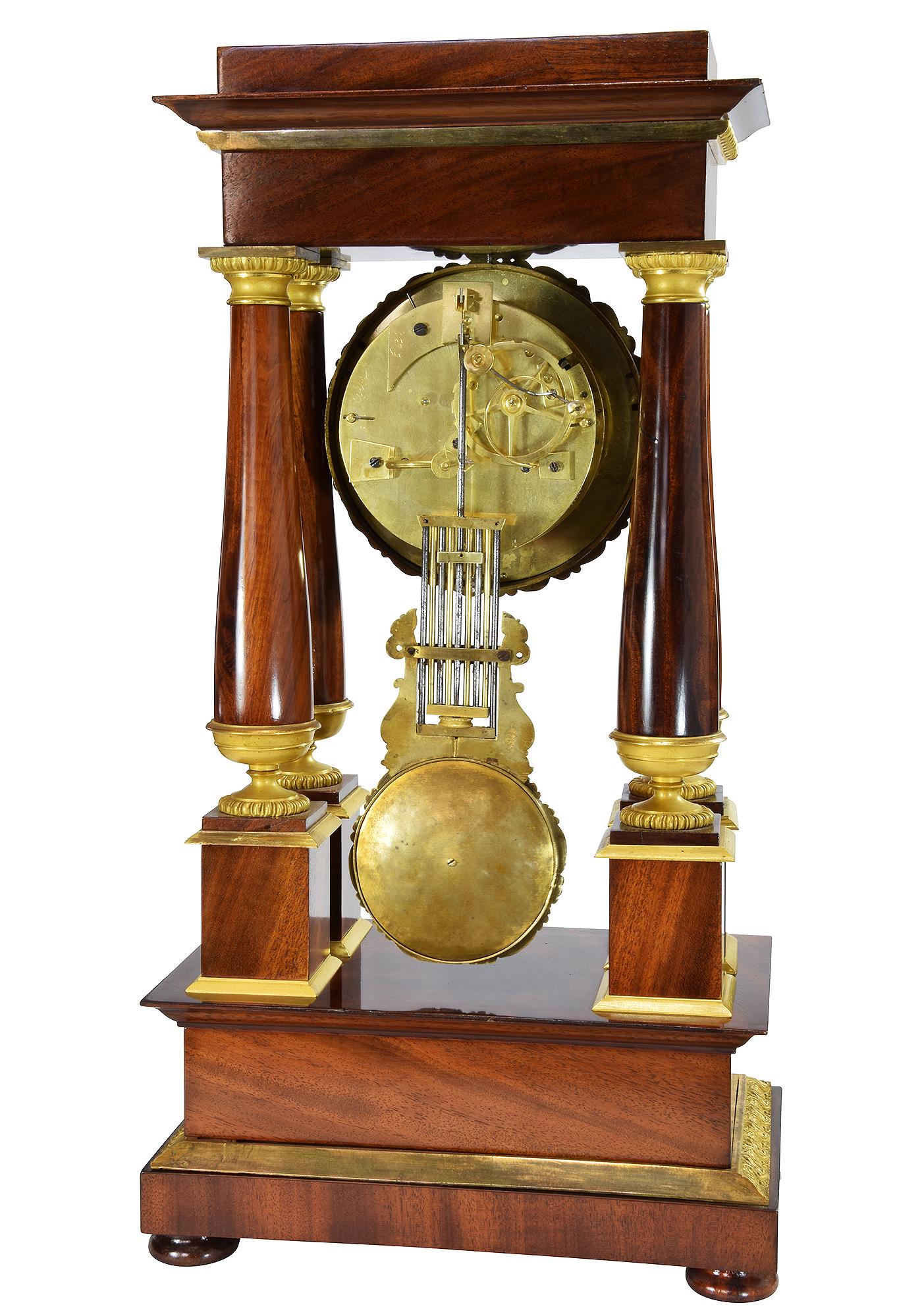 19th Century Portico clock in mahogany and bronze mercury gilding 1840