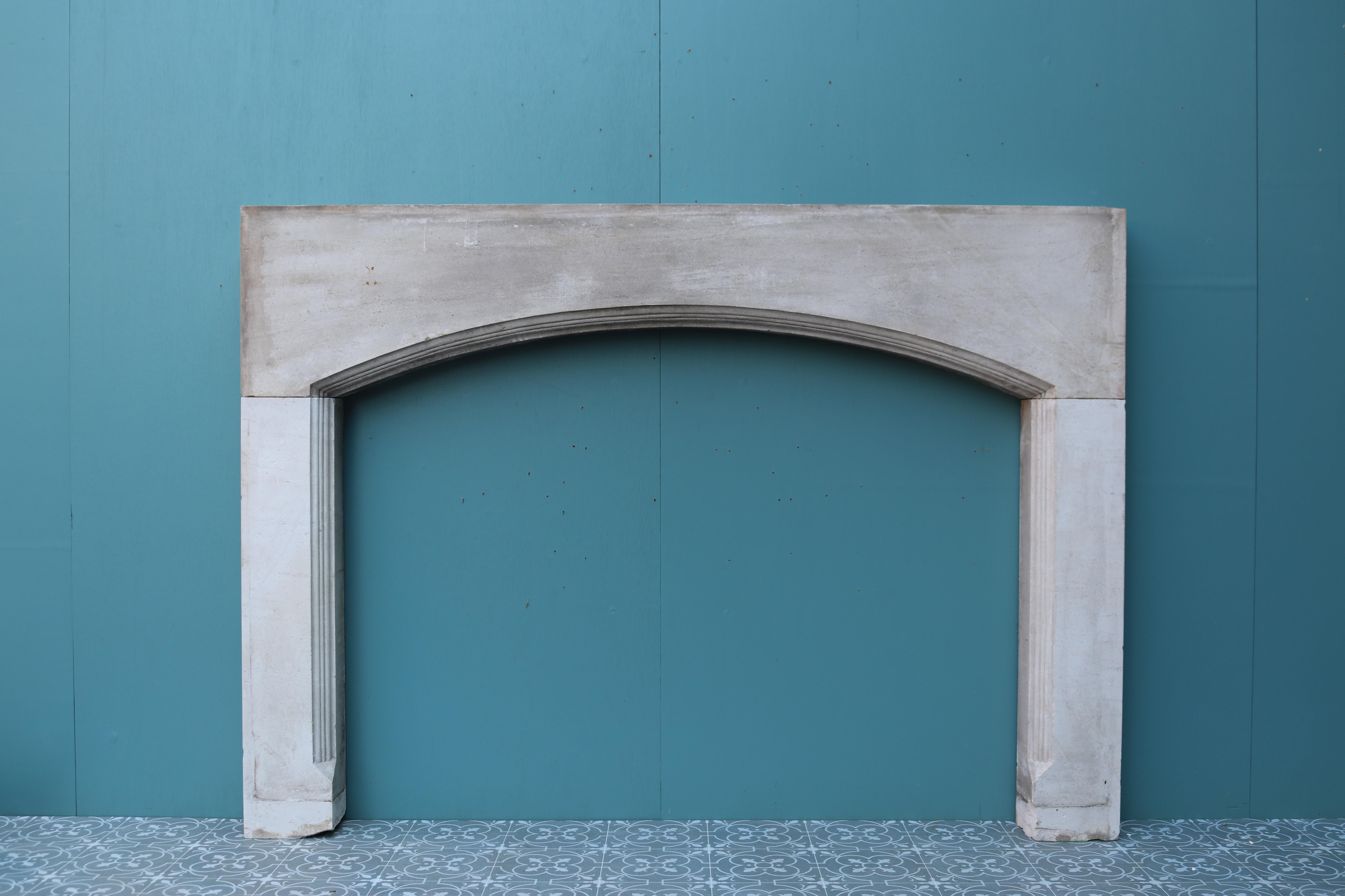 A large reclaimed Portland Stone fireplace with a shallow arched opening, salvaged from a country house.

Additional Dimensions:

Opening Height 101 cm

Opening Width  137.5 cm.