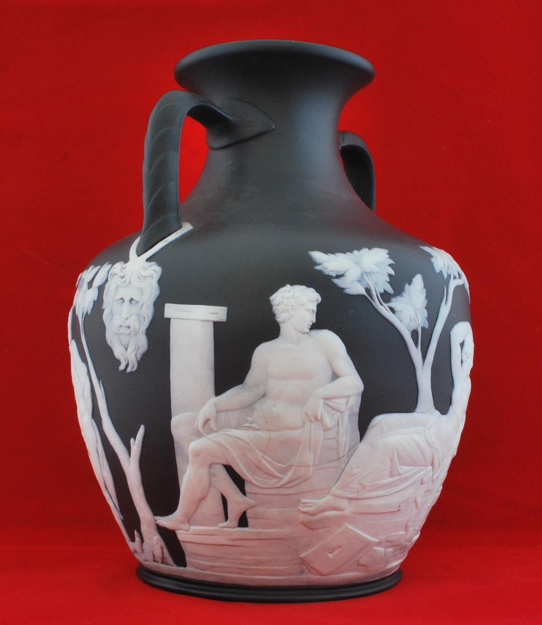 A full sized Portland vase in solid black jasper. This is the 'undraped' version, meaning it follows the original, rather than having draperies strategically placed.

A superb example, with really good translucence. There is a small loss to the