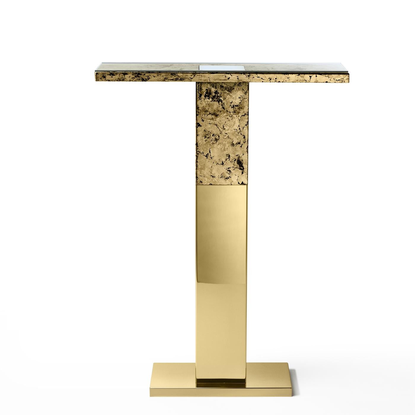 This stainless steel console by Andrea Branzi is backlit and ideal to display vases, books and sculptures. Its minimalist design is adorned by a hand-made finish on the top for a two-tone effect.
 