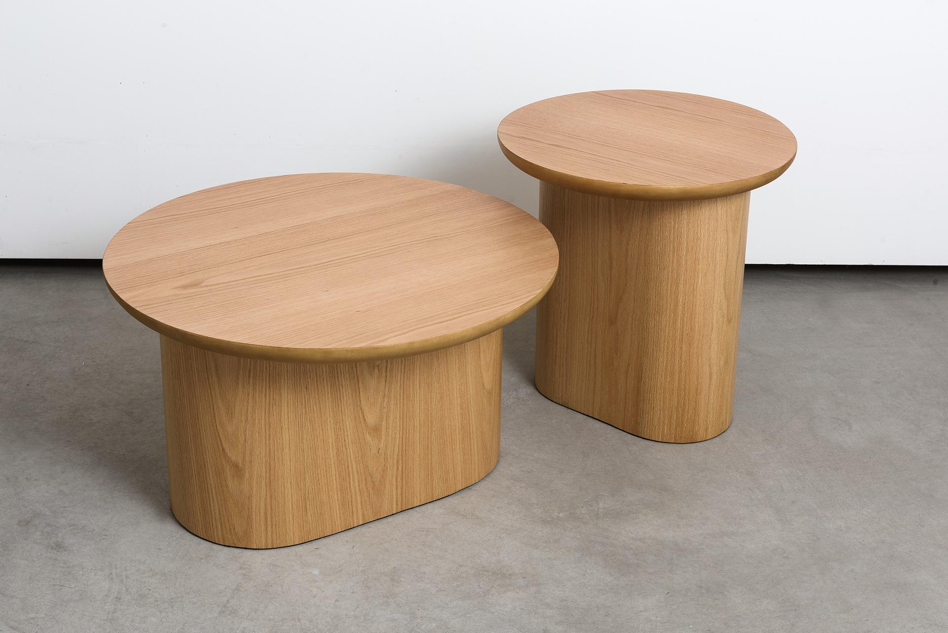Set composed of two Porto side tables, a high and a low.
Dimensions: High table D 50/ H 50 cm - Low table D 70/ H 40 cm 

Porto low tables are composed of a circular top that seems to rest on a sturdy oblong base. Lightness and weight overlap