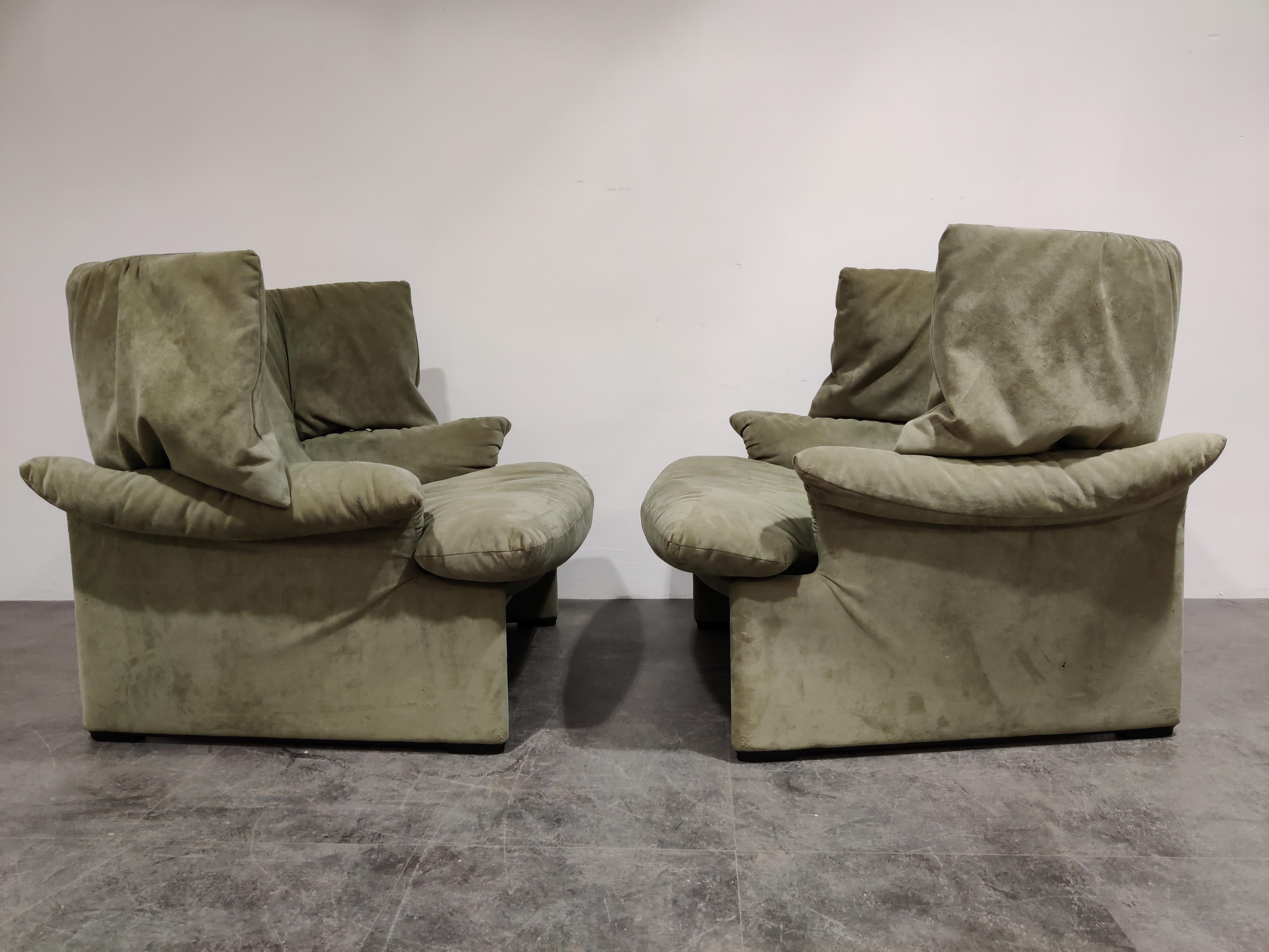 Pair of exquisite olive green velvet portovenere wingback chairs designed by Vico Magsitretti for Cassina.

This chairs are beyond comfortable. Once seated you will stay seated in them for a long while...

This design is less know then the