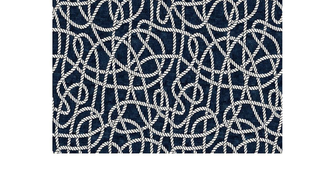 Inspired by the charming and luxurious sea town of Portofino, in Liguria, this elegant rug will be an ideal choice for a coastal interior or a refined boat. This unique piece is hand knotted by expert artisans in Nepal using 50% Himalayan wool for