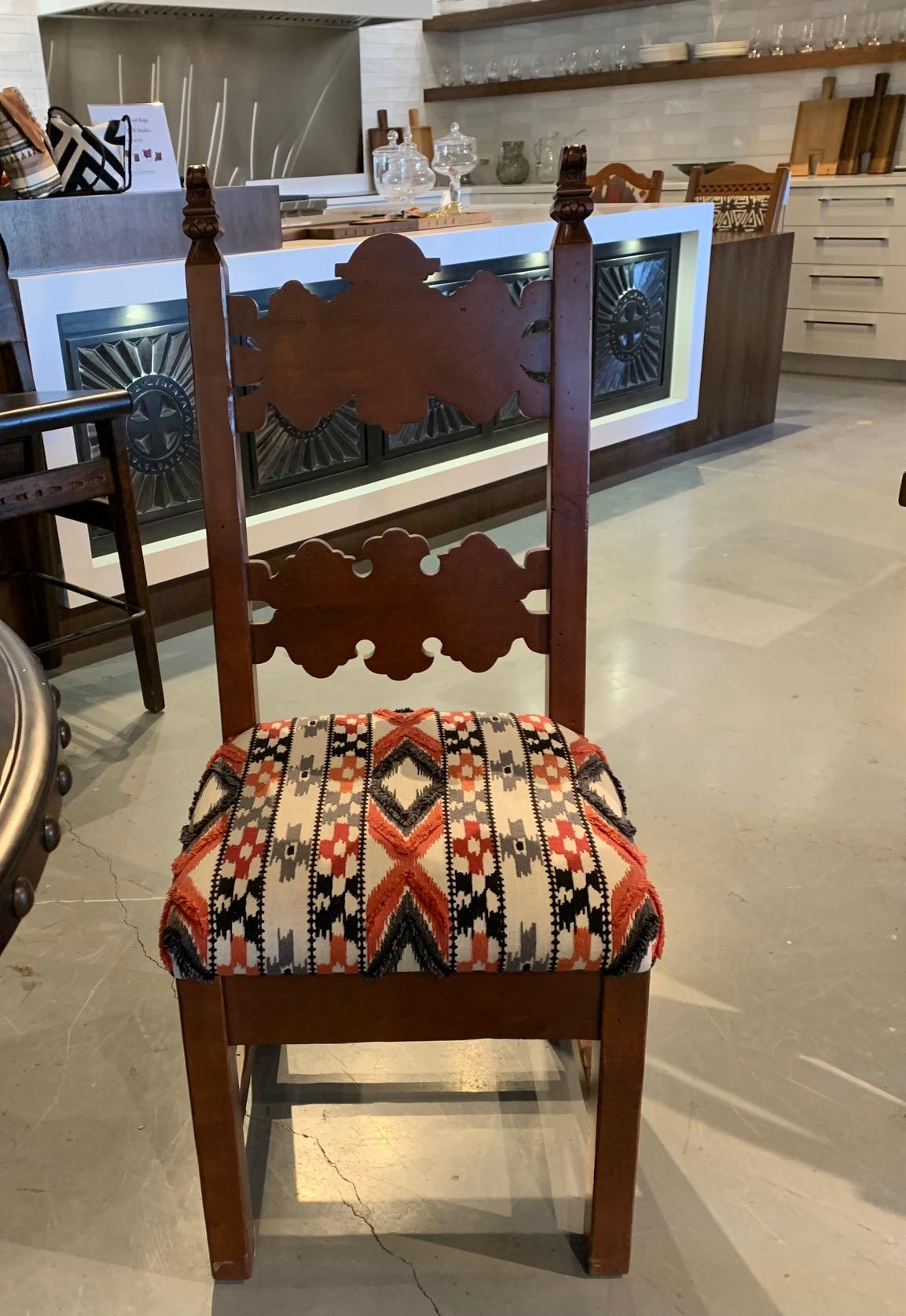 Beautiful hand carved Ernest Thompson Portofino Dining Chairs.

These are showroom floor models in perfect condition.

Set of 4 chairs.5,