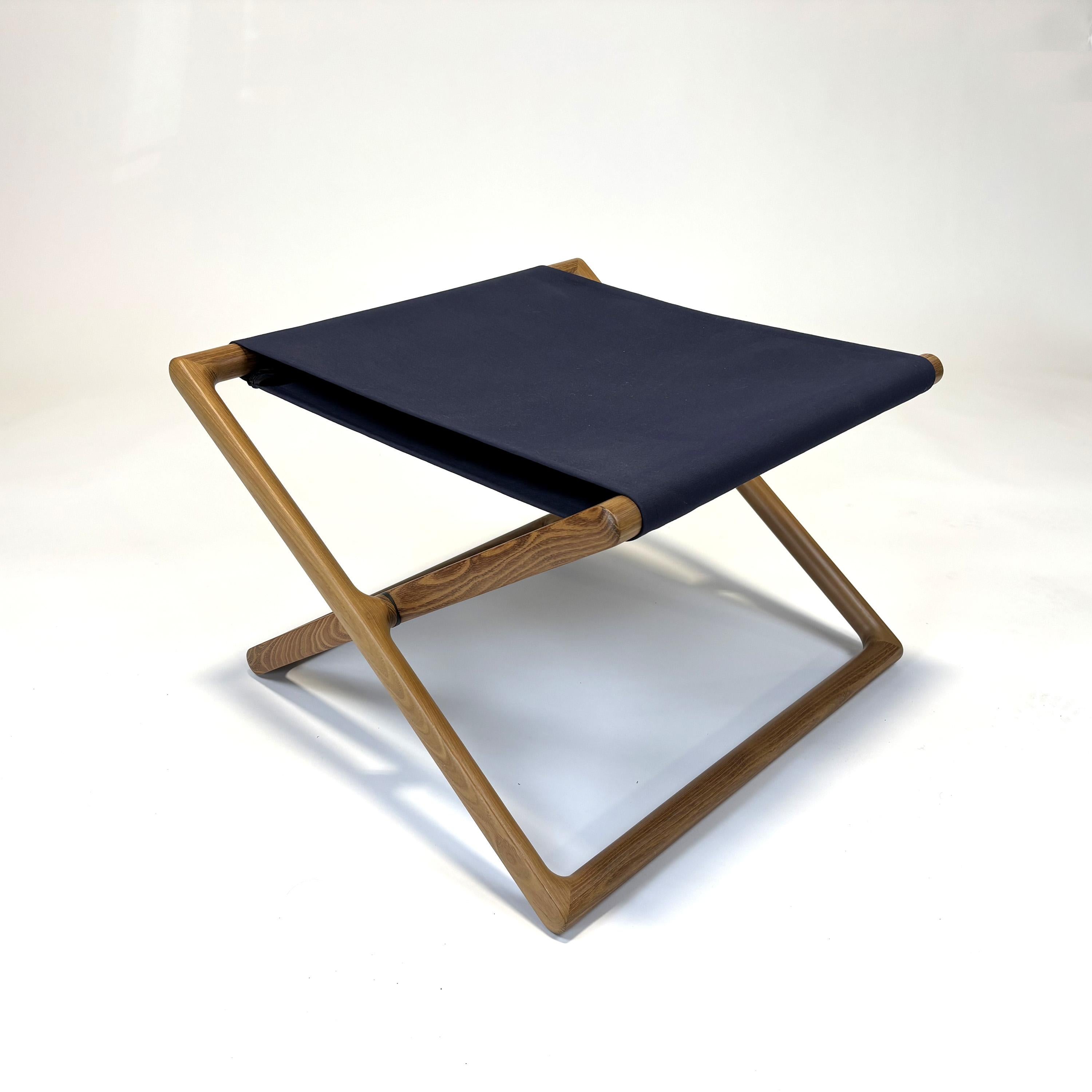 Portofino Folding Stool by Vincent Van Duysen for Paola Lenti
2014
Natural locust heartwood treated with an industrial acrylic wax varnishing. Plastic spacers.
Sling in Tamil Fabric, 100% Polyester, Dark Blue.

Can be used indoors or outdoors.