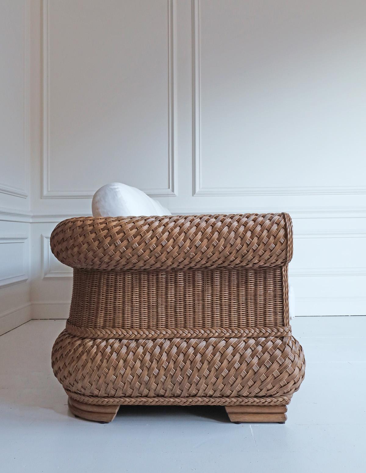 Italian style rattan 2 seater sofa in natural finish.

White cotton cushions included. 

Dimensions:-

H 72 x W 182 x D 90cm

Seat H 46cm

*Handmade product with natural fibres. Finish and colour will vary in each piece.