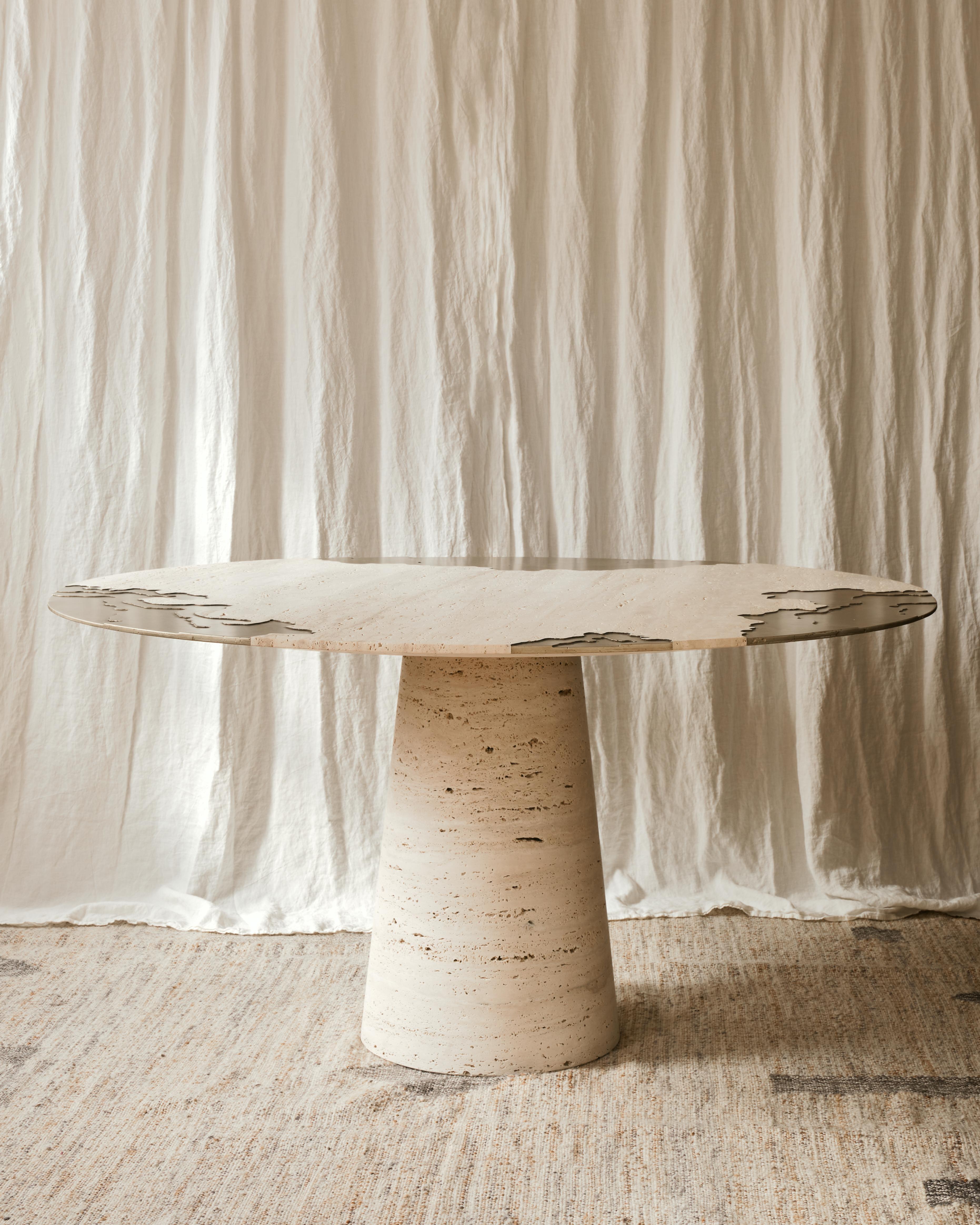 Portonovo Table by Studio Sam London
Dimensions: ⌀ 145 x H 75 cm
Materials: Honed Travertine and Liquid Metal

The Portonovo dining table is the very first piece created for Studio Sam Collection. Made of the whitest travertine, the top surface is