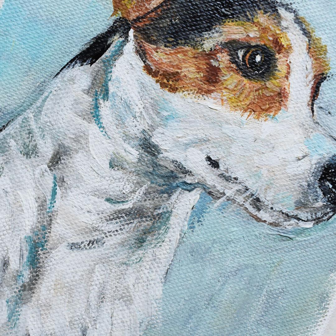 A small portrait painting of a terrier dog on canvas. The painting’s subject glances off to it’s side with an eager look on its face. Black and brown spots cover the head and ears on it’s white body. The background is in a beautiful pale blue.