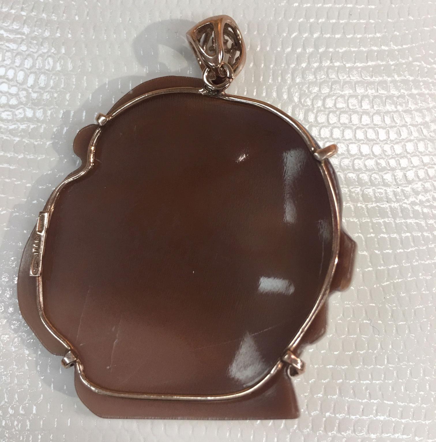 Hand carved shell Cameo Pendant, depicting the profile of a Subtlety Beautiful young girl with flowers in her hair, set in a Rose Gold Sterling Silver mounting. Rendered with remarkable detail and warmth, so unusual to find! Measuring approx. 2.25