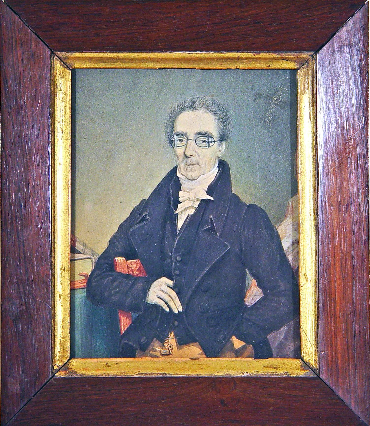 Portrait Miniature of A Gentleman Wearing Unusual Eyeglasses,
Circa 1845.

The portrait is on board depicts a tall man sitting on a chair, his right arm encircling the chair upon which his sits.  he is dressed in a black jacket and waistcoat with a