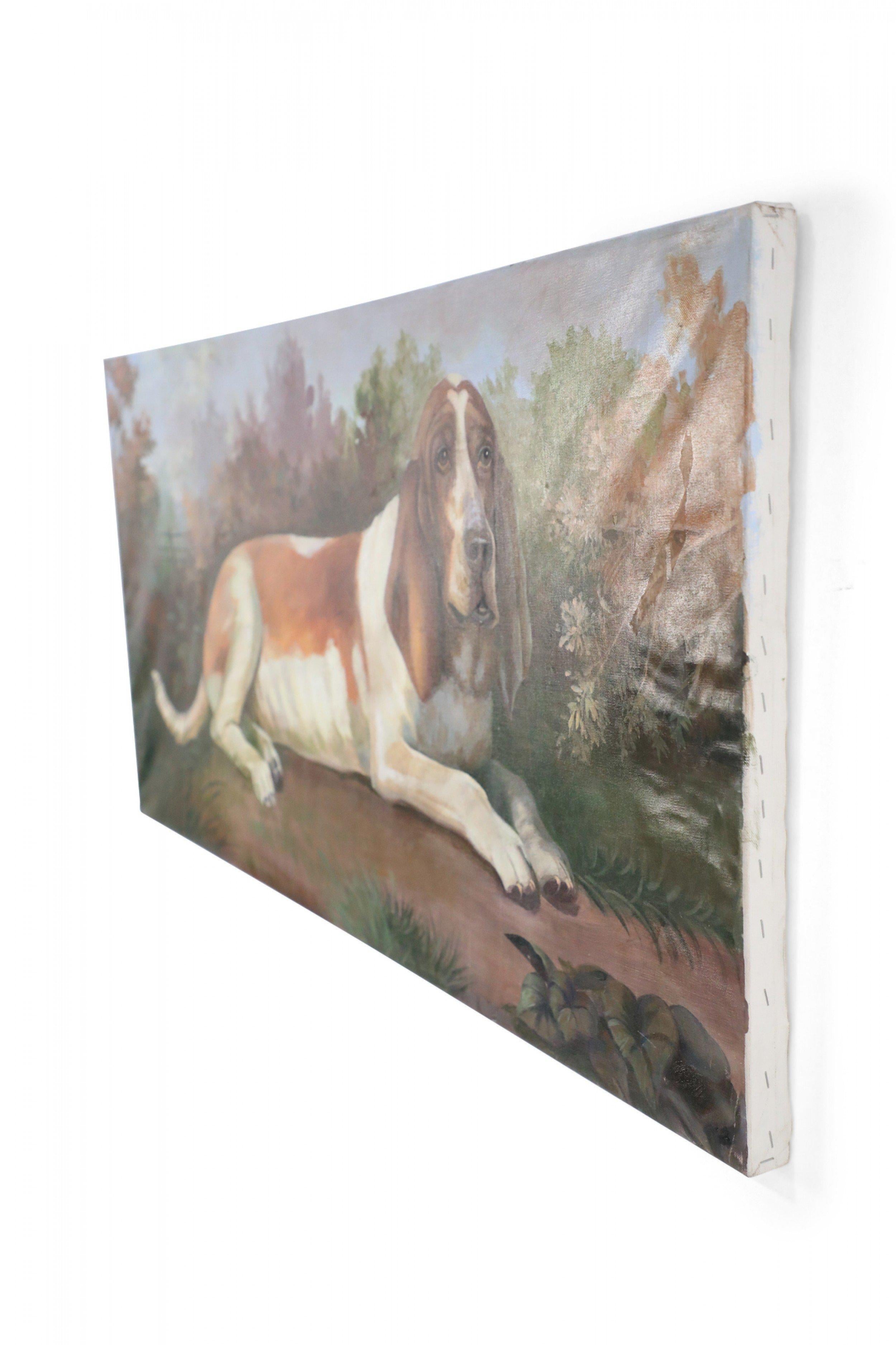 Vintage (20th Century) portrait of a brown and white basset hound captured on a path amid grasses and autumnal plants and trees, on a large rectangular unframed canvas.