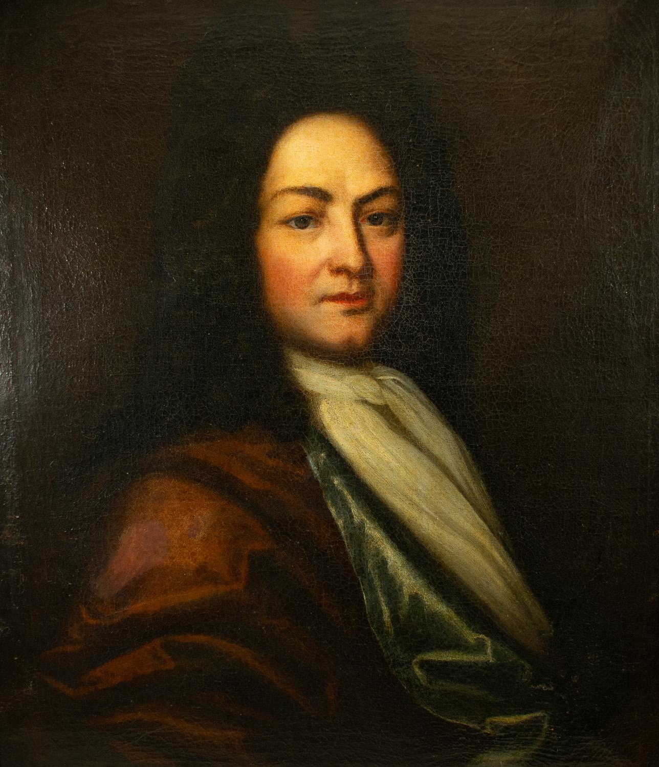 A Striking Large Portrait of a French Nobelman oil on canvas, late 17th/early 18th century.

The subject dressed in a velvet gown and white neck tie and wearing a flamboyant long black wig which was fashionable in the period.

Crackling overall and