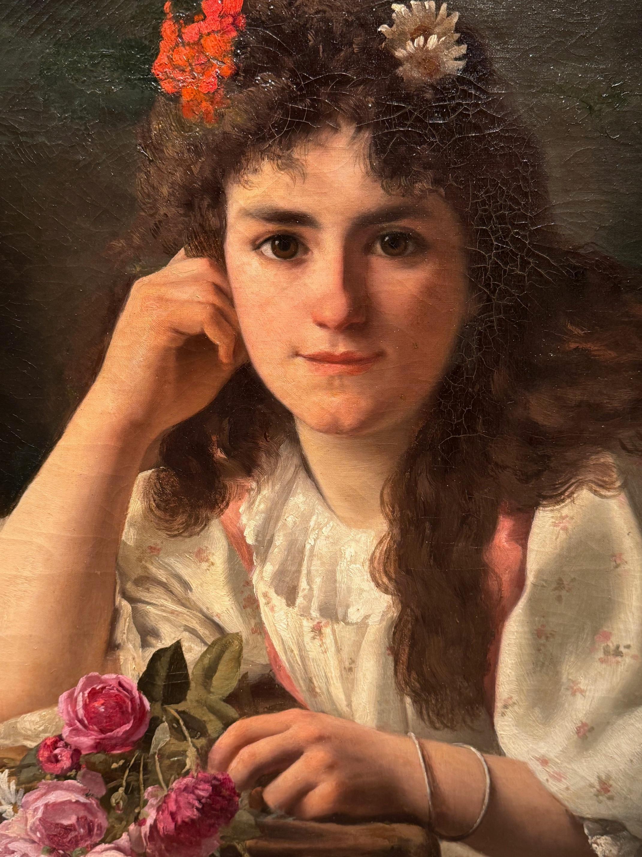 Portrait of a young girl leaning against a carpeted cabinet, her left hand on a casually placed bouquet of roses.
She is also wearing flowers in her hair.
The gaze is very present, almost magnetic.
Original strecher and canvas; reinforcements at the