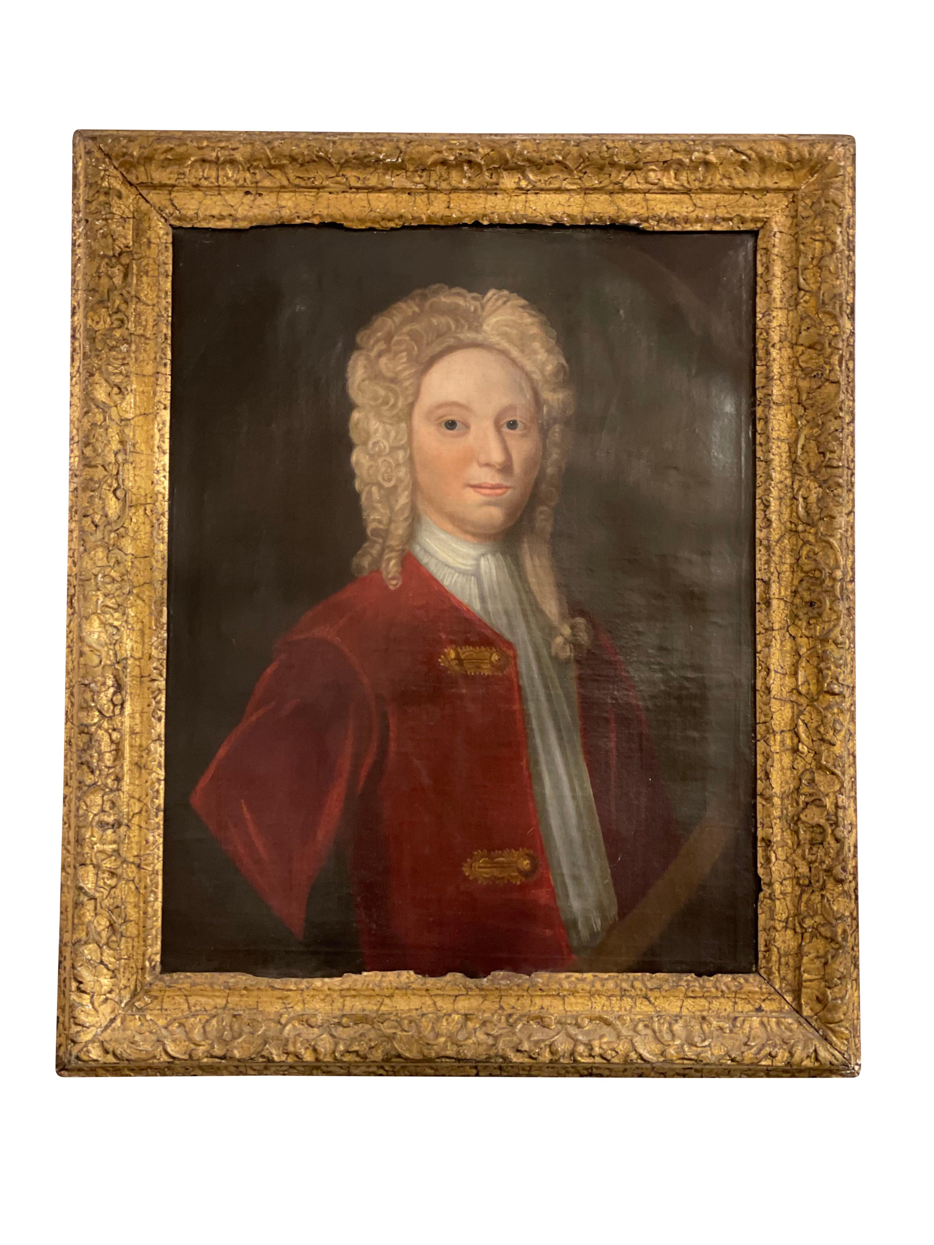 A delightful portrait of a young gentleman in a brilliant scarlet jacket with large gold buttons. offered with original hand carved wooden frame.