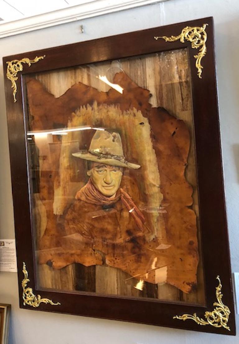 Sculptured and tooled painting on 
 leather

 3D painting on leather, mounted on the rugged backdrop and placed into the shadow box. 

American, circa 1950s
 Unsigned

 Measures: 28” W x 37” H, overall size is 36” x 45”.
  