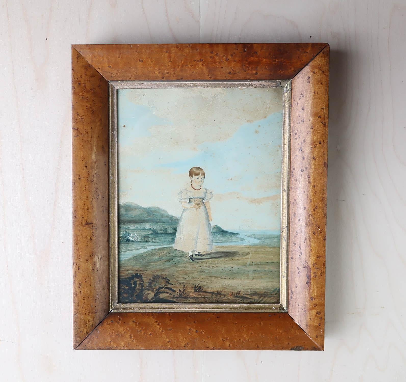 A lovely naive portrait of a young girl 

Interesting provenance on the verso

Watercolour on paper.

Condition report- Some surface loss, foxing and a tiny hole top left

Presented in an antique birds eye maple frame

The measurement given is the