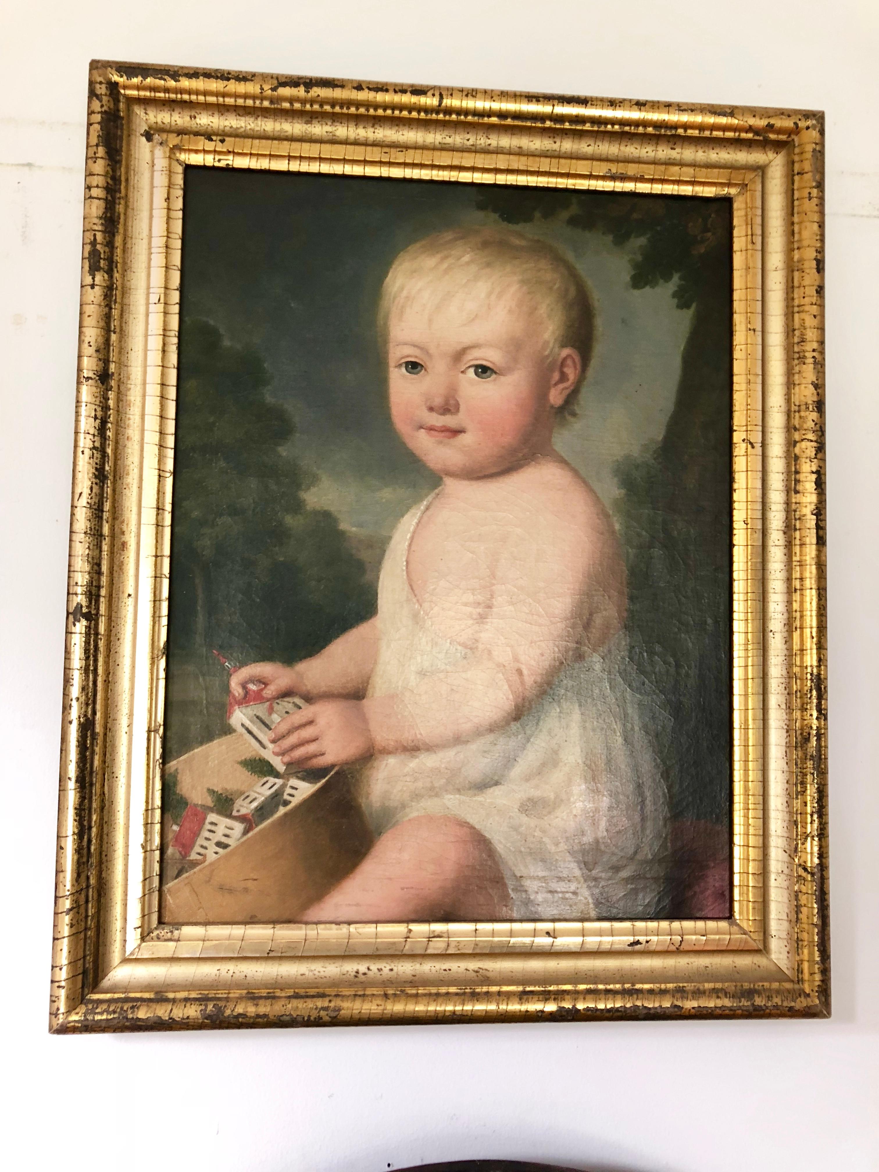 A charming oil-on-canves portrait of a young child seated with a wood band-box filled with his toys, American, early 19th century, in its original giltwood frame.
