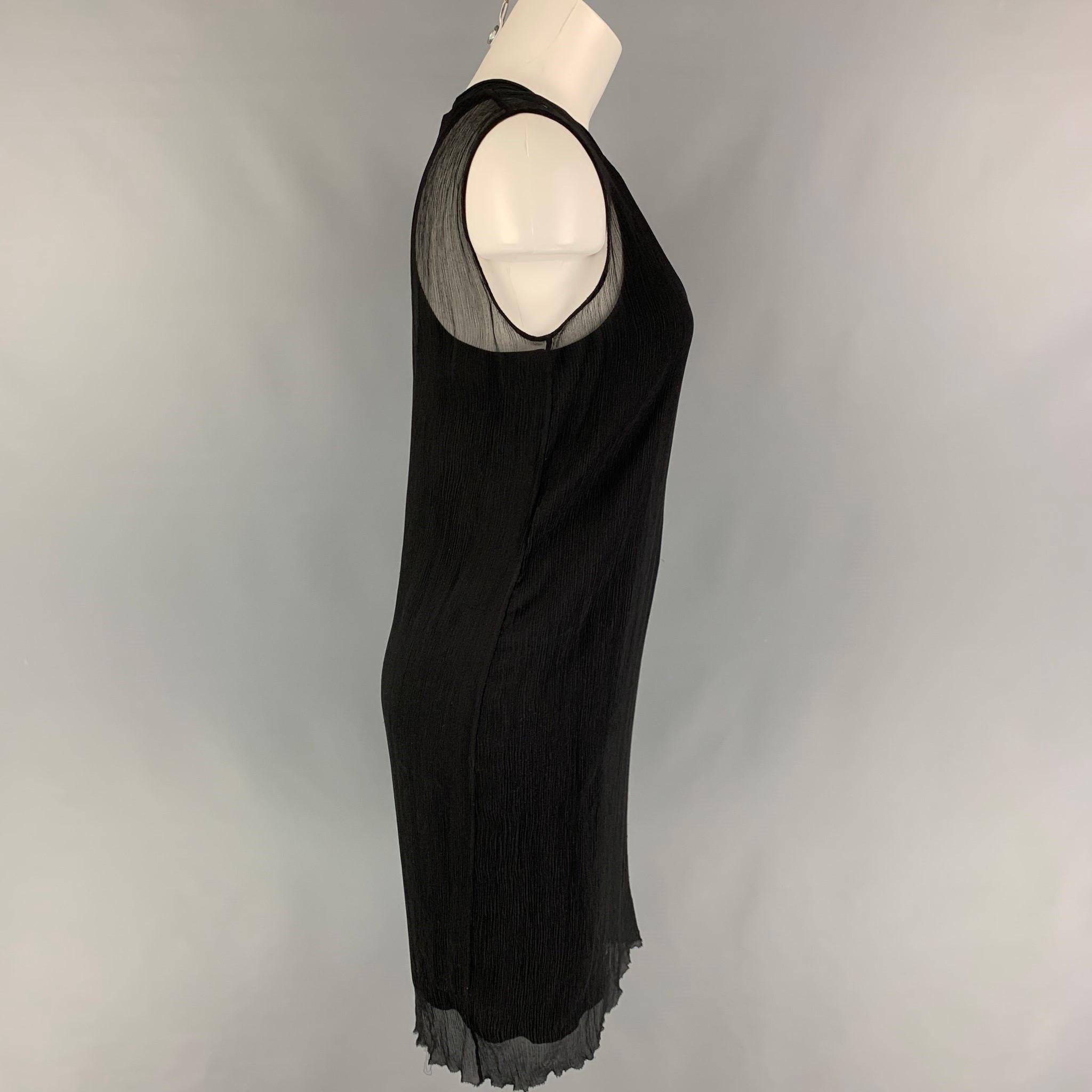 PORTS 1961 dress comes in a black wrinkled viscose featuring double layer style and no sleeves. 

Very Good Pre-Owned Condition.
Marked: 4

Measurements:

Shoulder: 14 in.
Bust: 32 in.
Hip: 36 in.
Length: 37 in. 