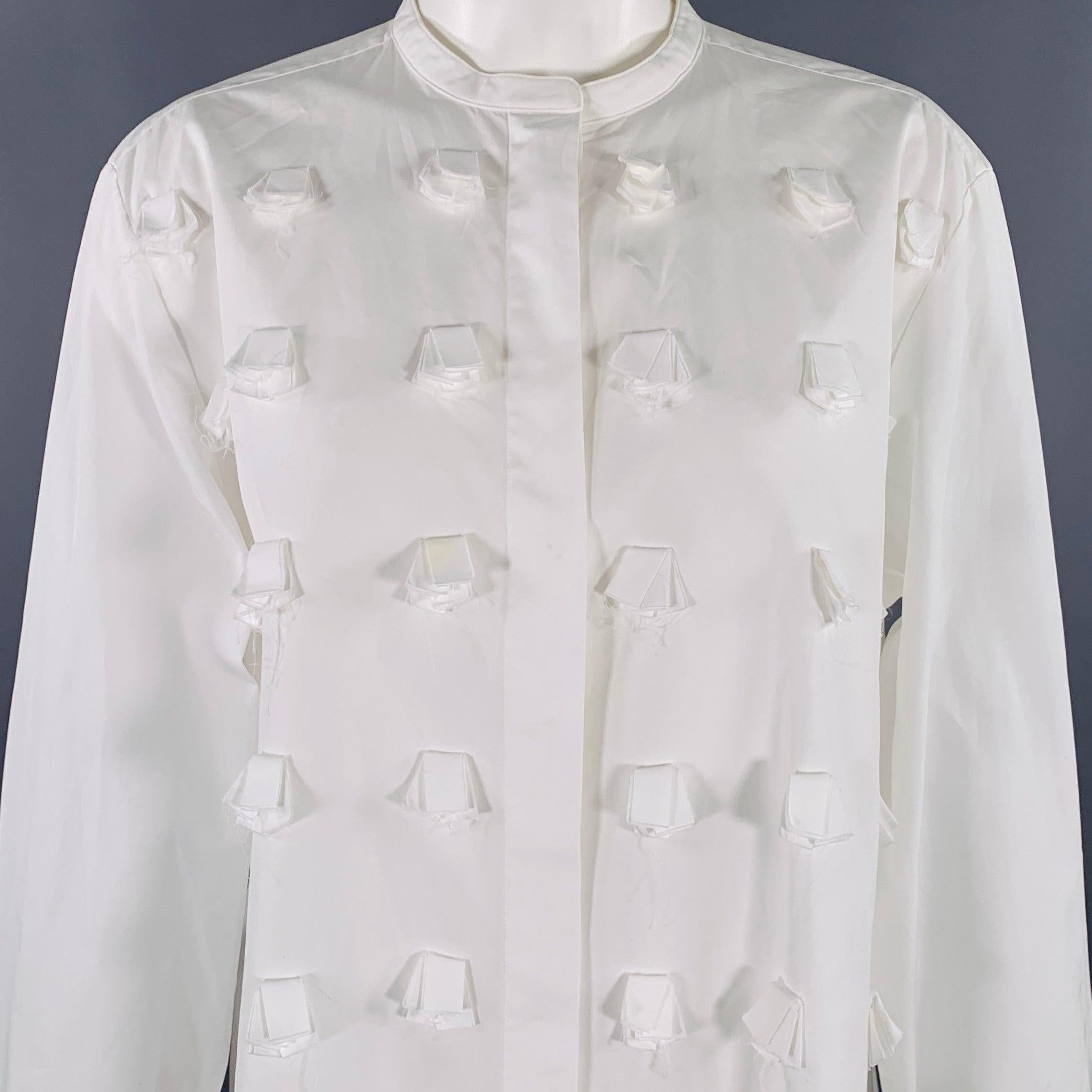 PORTS 1961 shirt
in a white cotton woven fabric featuring Nehru collar, folded fabric appliques, French cuffs, and button closure. Very Good Pre-Owned Condition. Moderate marks, as is. 

Marked:   46 

Measurements: 
 
Shoulder: 16 inches Bust: 41