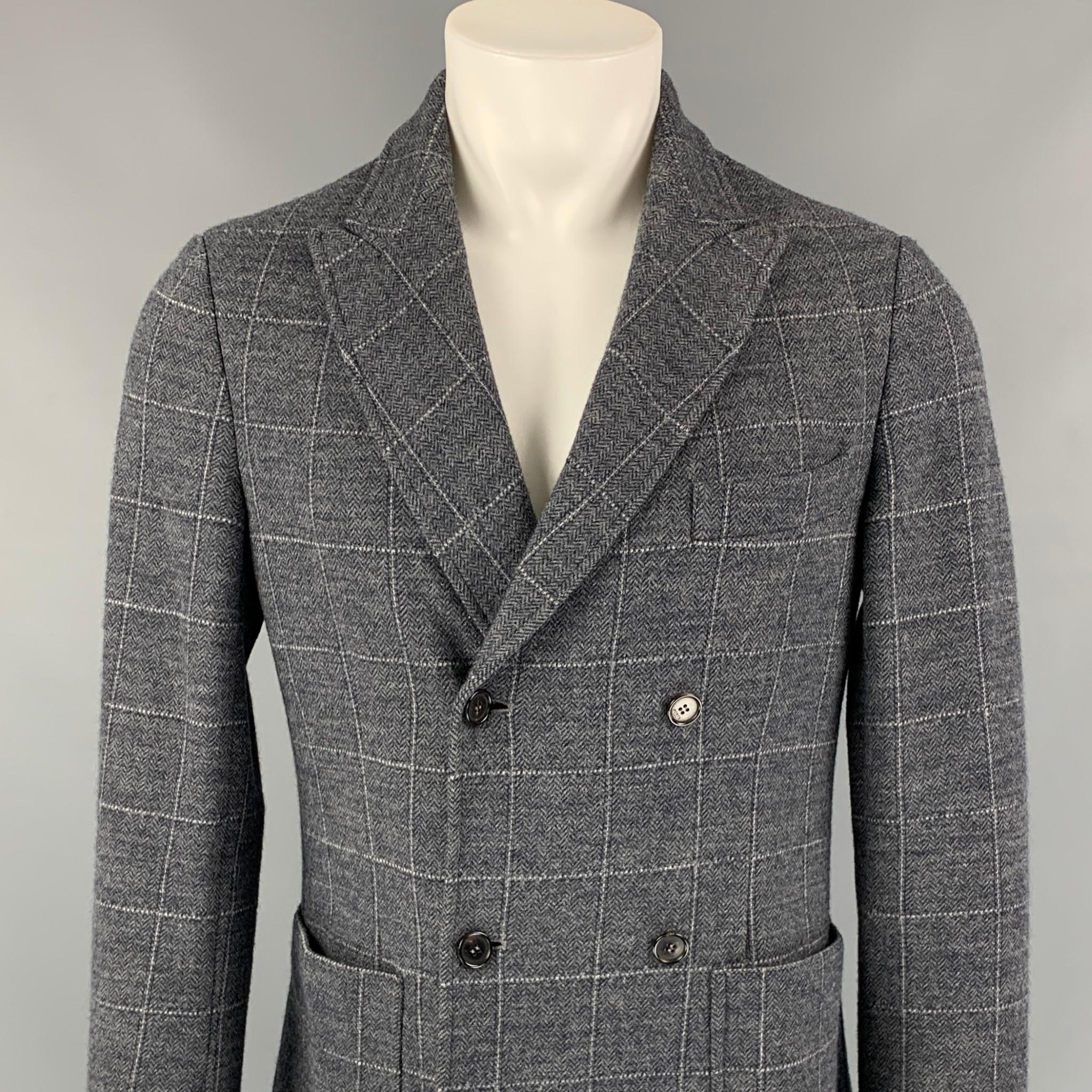 PORTS 1961 jacket comes in a grey & cream window pane wool blend with a half liner featuring a peak lapel, patch pockets, and a double breasted closure. Made in Italy. 

Excellent Pre-Owned Condition.
Marked: S

Measurements:

Shoulder: 17