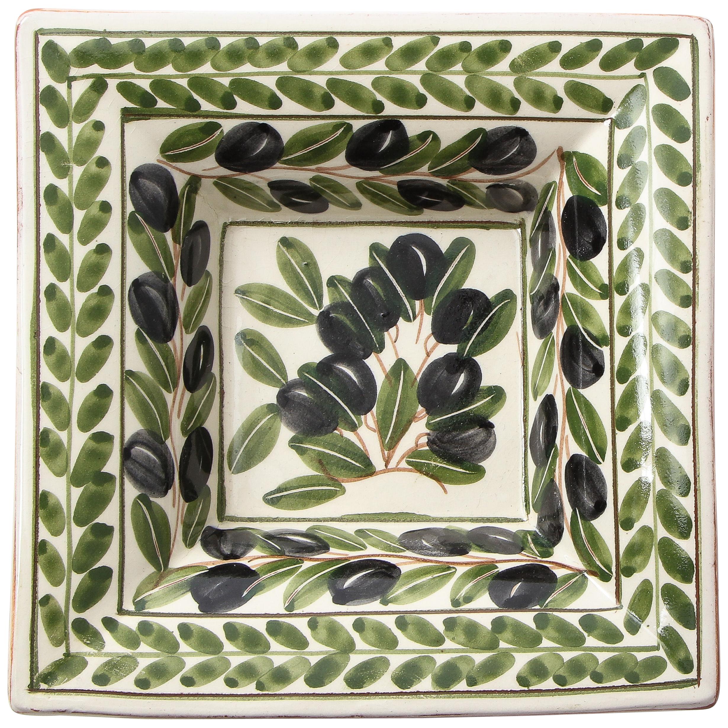 Portugese ceramic vide poche or ashtray adorned with painted olives and their leaves leaves. Underneath is a glazed terra cotta color.