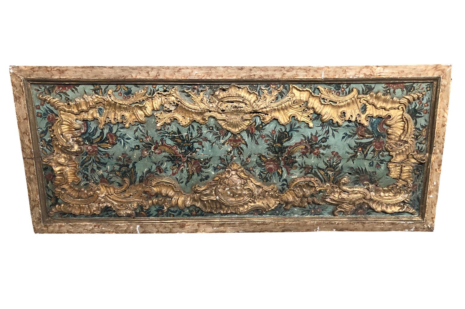 An exceptional 18th century boiseries panel from Portugal in polychromed and giltwood. Stunning color and wonderful patina. Perfect as a headboard or to build in.
