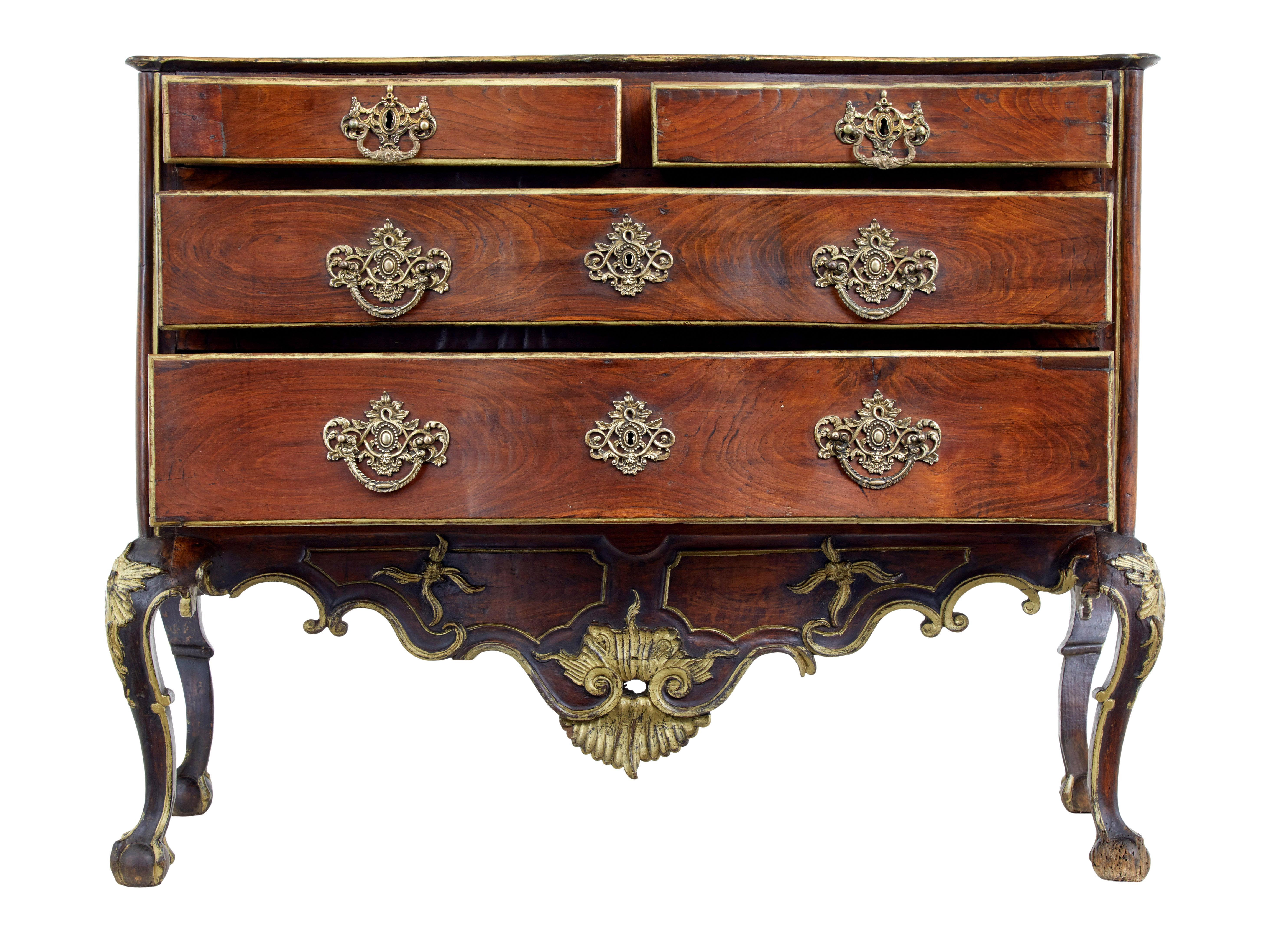 Portuguese 18th century carved walnut and gilt commode circa 1770.

Stunning quality portuguese chest of drawers, which sums up perfectly the over indulgence of the period.

Dom jose period, fitted with 2 short over 2 long drawers profusely carved