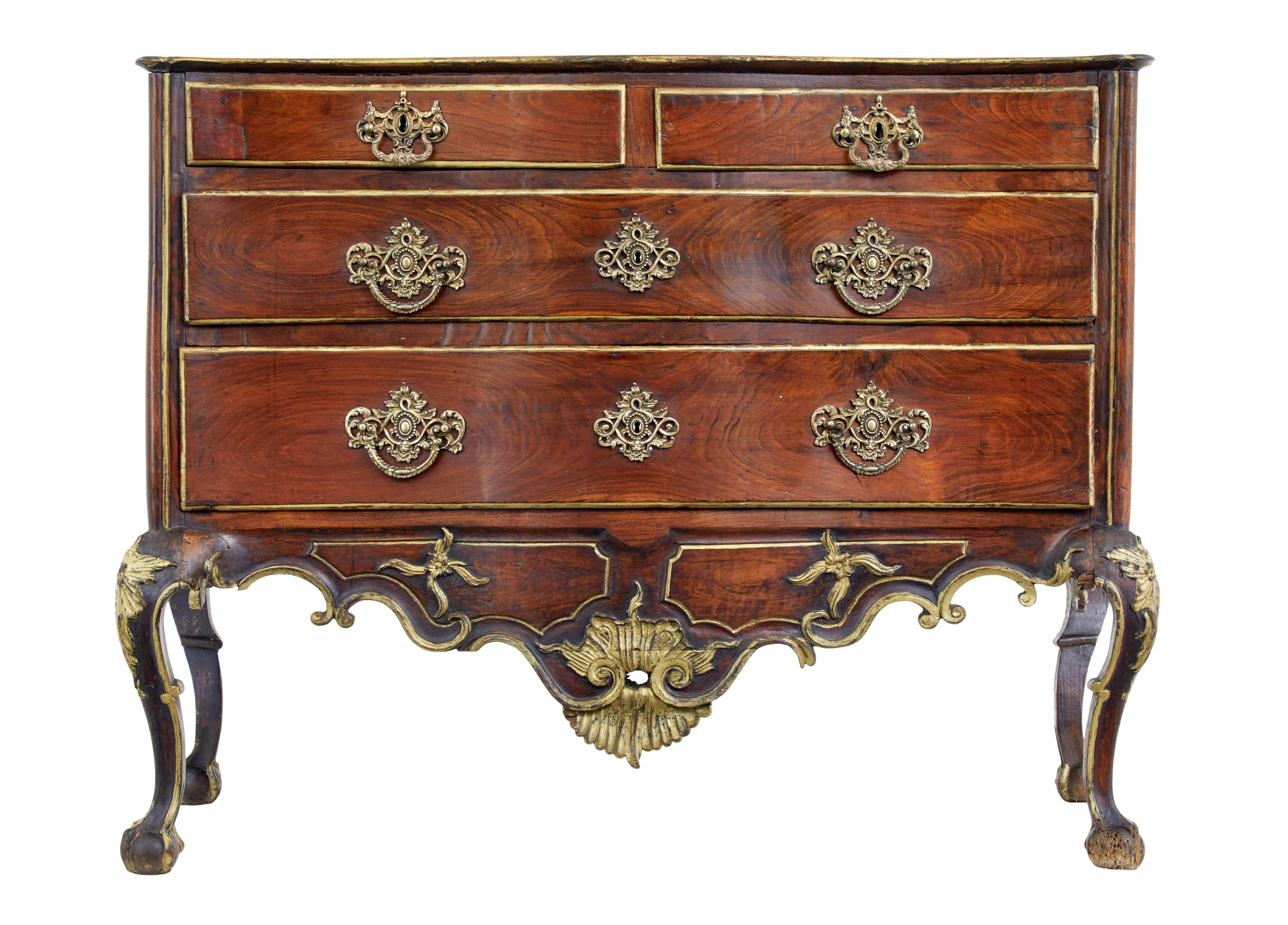Portuguese 18th century carved walnut and gilt commode circa 1770.

Stunning quality Portuguese chest of drawers, which sums up perfectly the over indulgence of the period.

Dom jose period, fitted with 2 short over 2 long drawers profusely carved