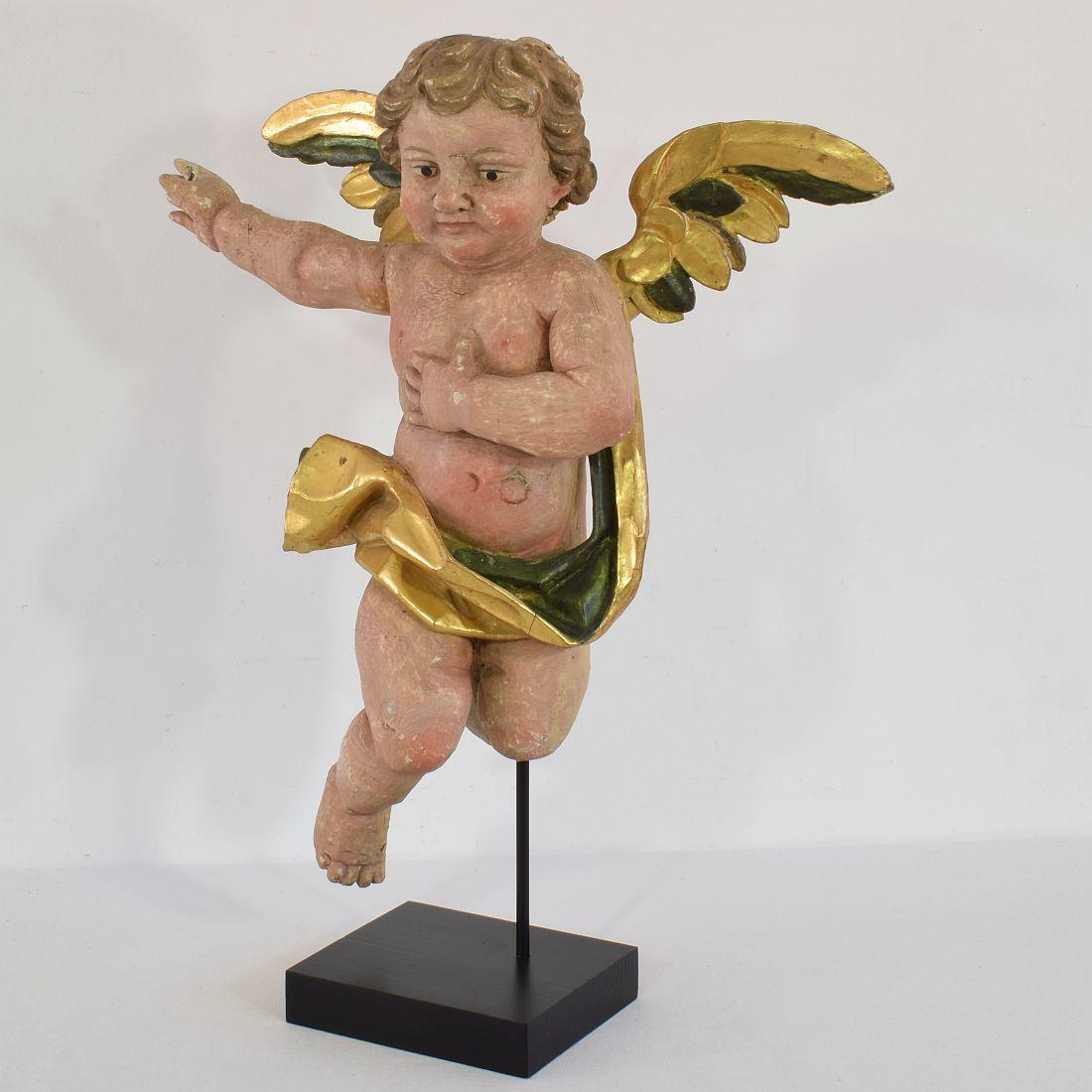 Beautiful and large naive baroque angel. Unique period piece,
Portugal, circa 1750-1800
Weathered. Small losses and old repairs.
More pictures on request.
Measurement here below includes the wooden base.

   