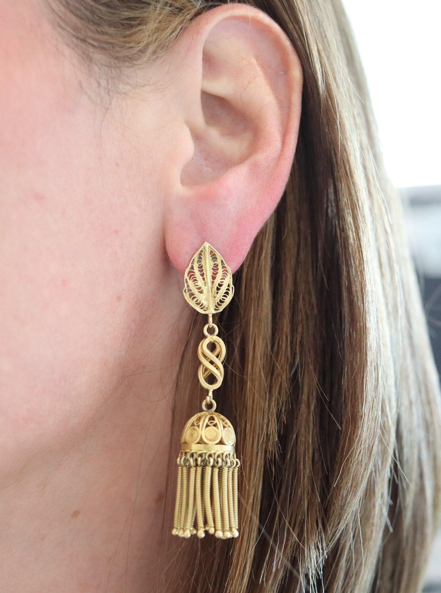 A Portuguese Iberian fringe earrings made in the city of Porto.

This a a gorgeous pair of Iberian dangle earrings with fringes, created in the city of Porto in Portugal during the very early 20th century, back in the 1910. The earrings have been