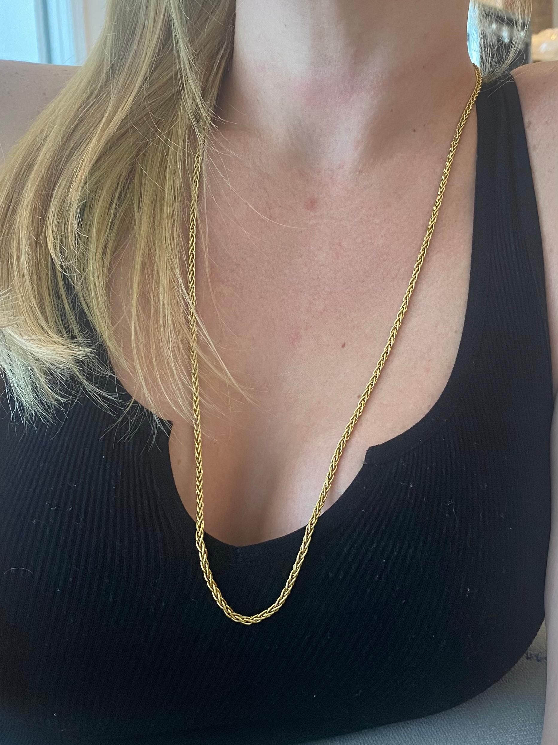 A Portuguese textured chain made in the city of Porto.

Rare piece made in the city of Porto in Portugal during the art deco period, circa 1930's. This gorgeous elegant woven chain was crafted with impeccable details in solid yellow gold of 19.2