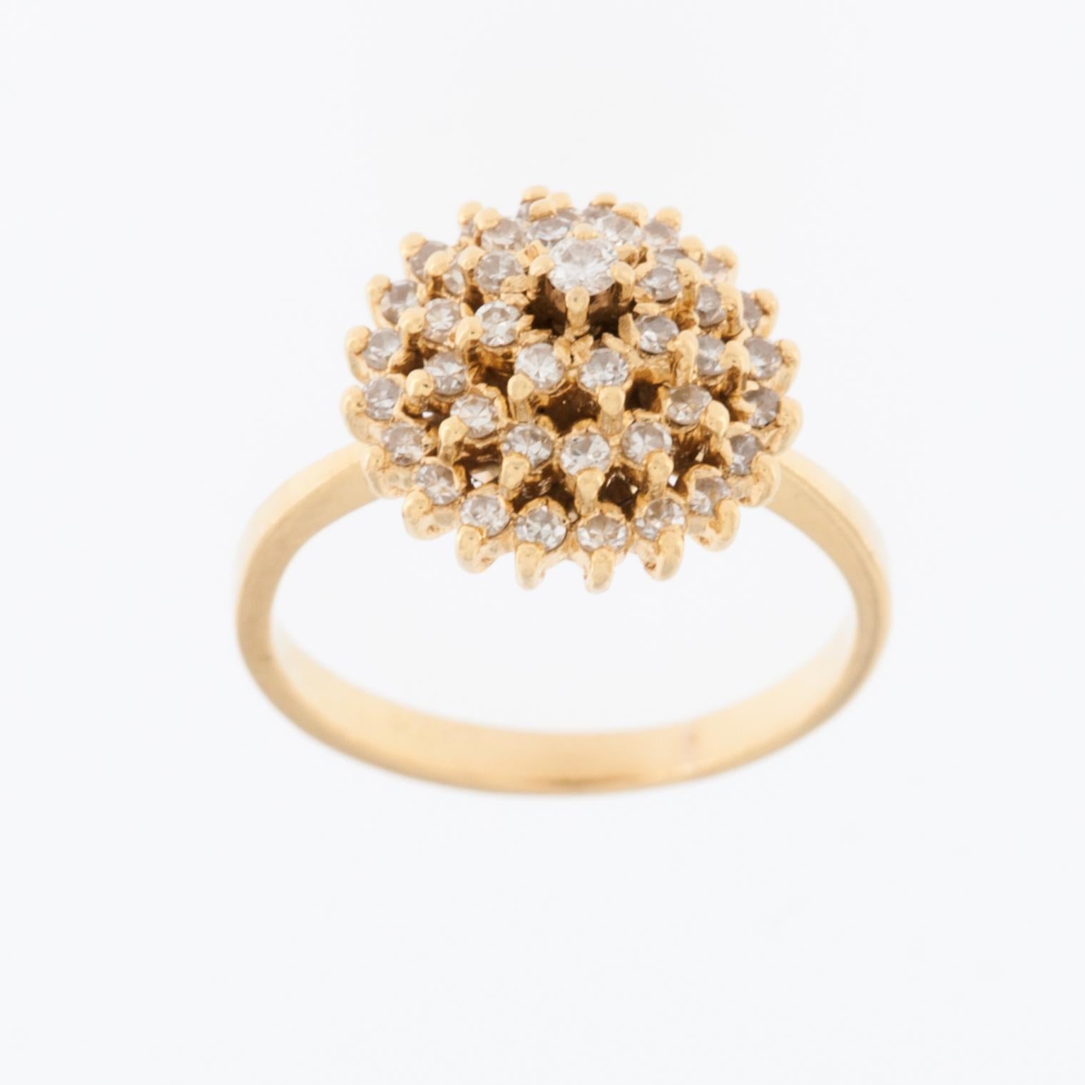 This Portuguese 19kt Yellow Gold Ring with Diamonds is a luxurious and elegant piece of jewelry. It is crafted from 19 karat (19kt) yellow gold, which is known for its rich, warm color and durability. The ring features an exquisite design with the