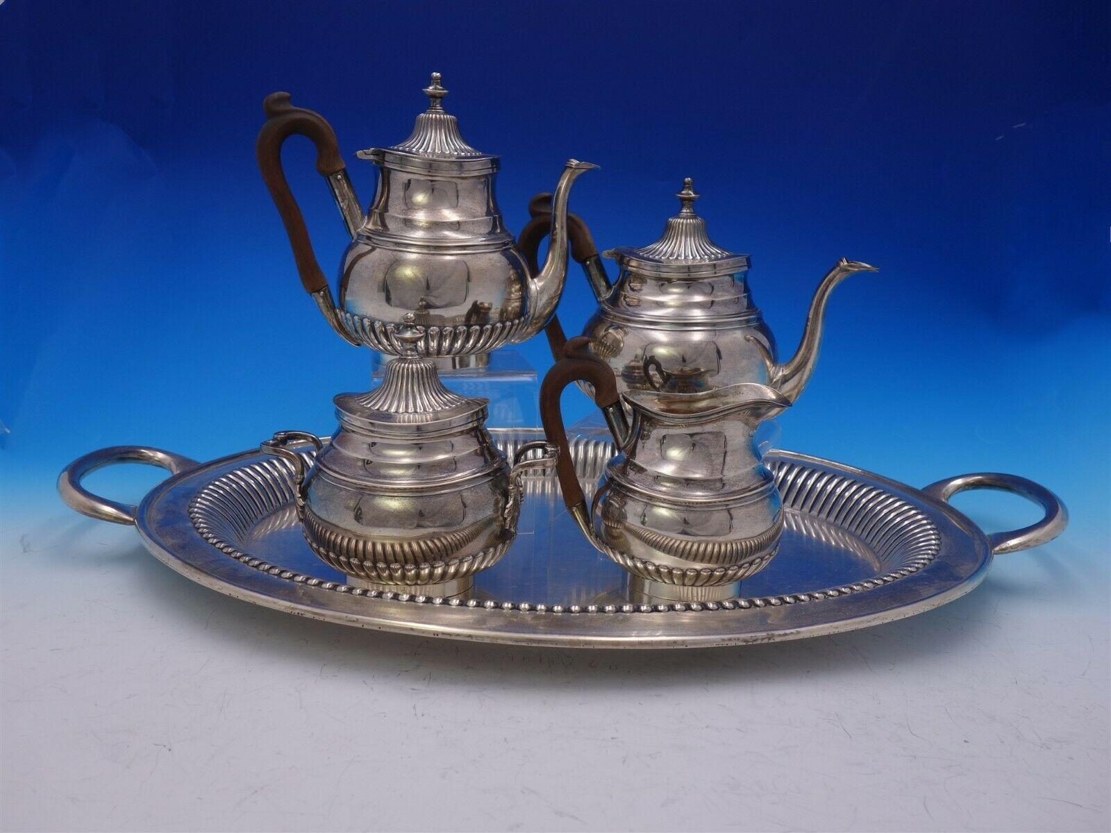 Wonderful Portuguese .833 silver 5-piece tea set with fluted / ribbed design. This set includes:

1 - Coffee pot (with wood handle): Measures: 8 1/2