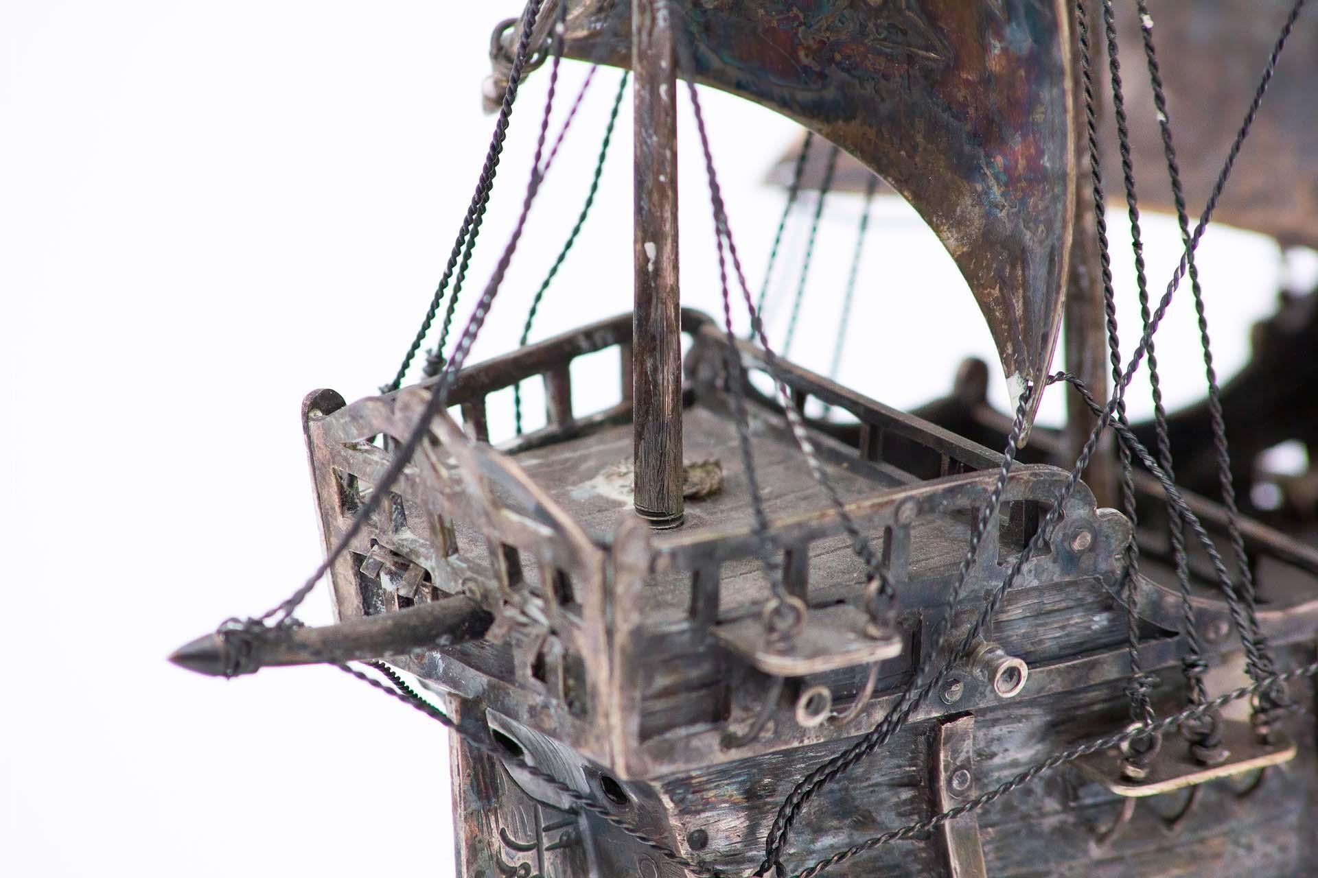 Description: Portuguese silver caravel, profusely defined and set on a wooden base. Metal: Silver. Origin: Portuguese. Brand: Eagle's Head. Weight: 1007.47 grams. Dimensions: 26cmx29cm. Content: 833/1000. Assay Mark: Yes, between 1938 and 1984.