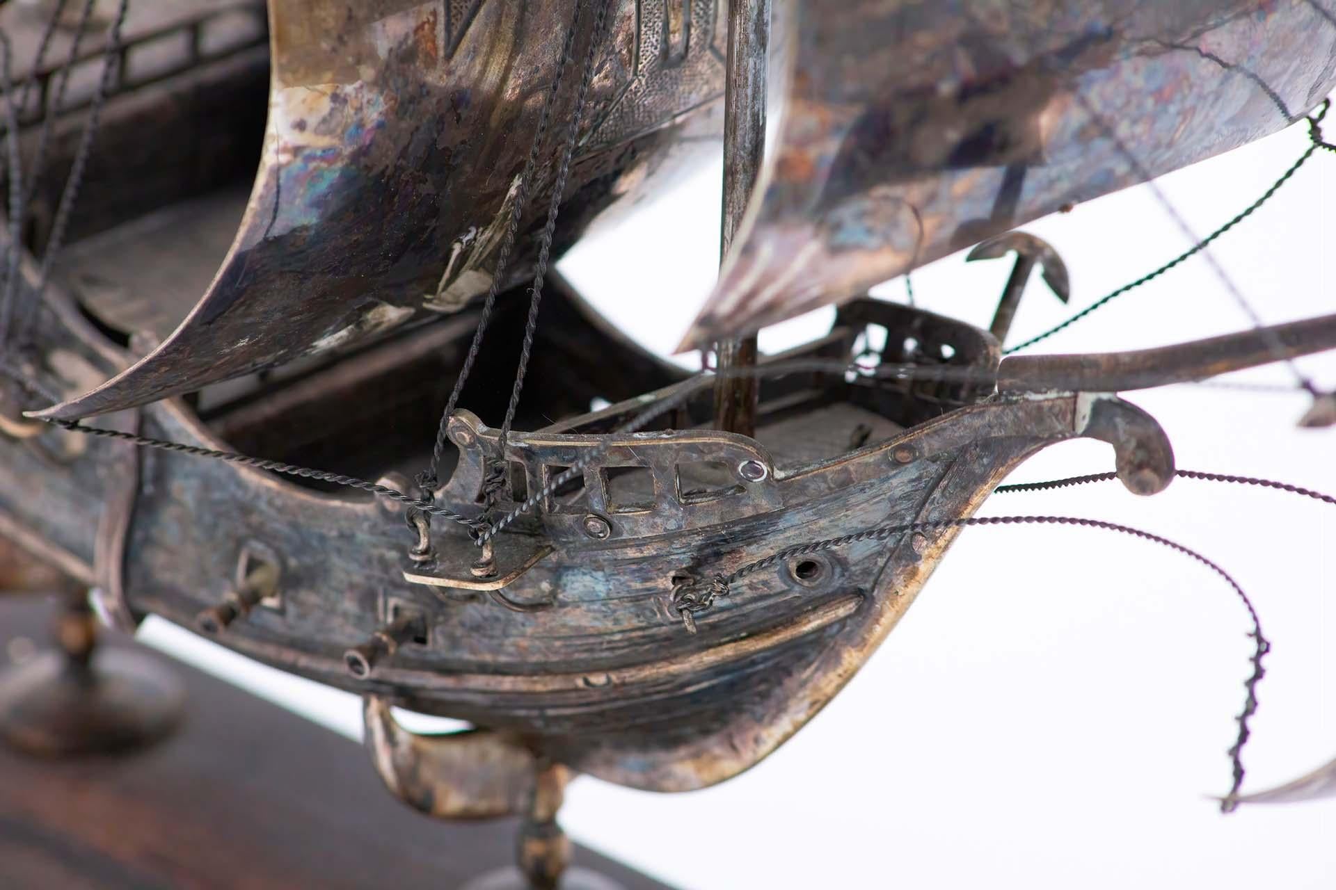 European Portuguese caravel in profusely defined silver and set on a wooden base For Sale