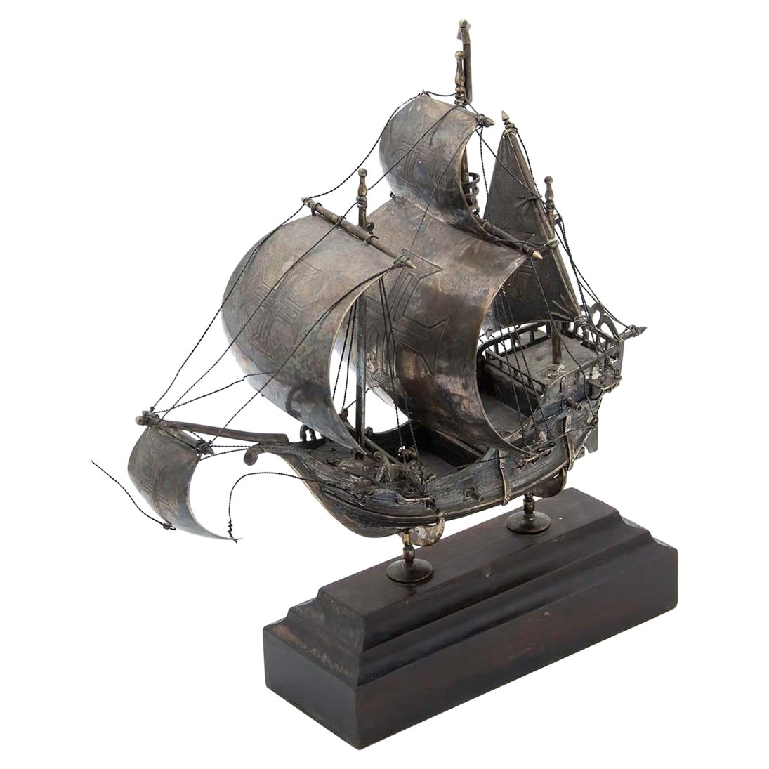 Portuguese caravel in profusely defined silver and set on a wooden base