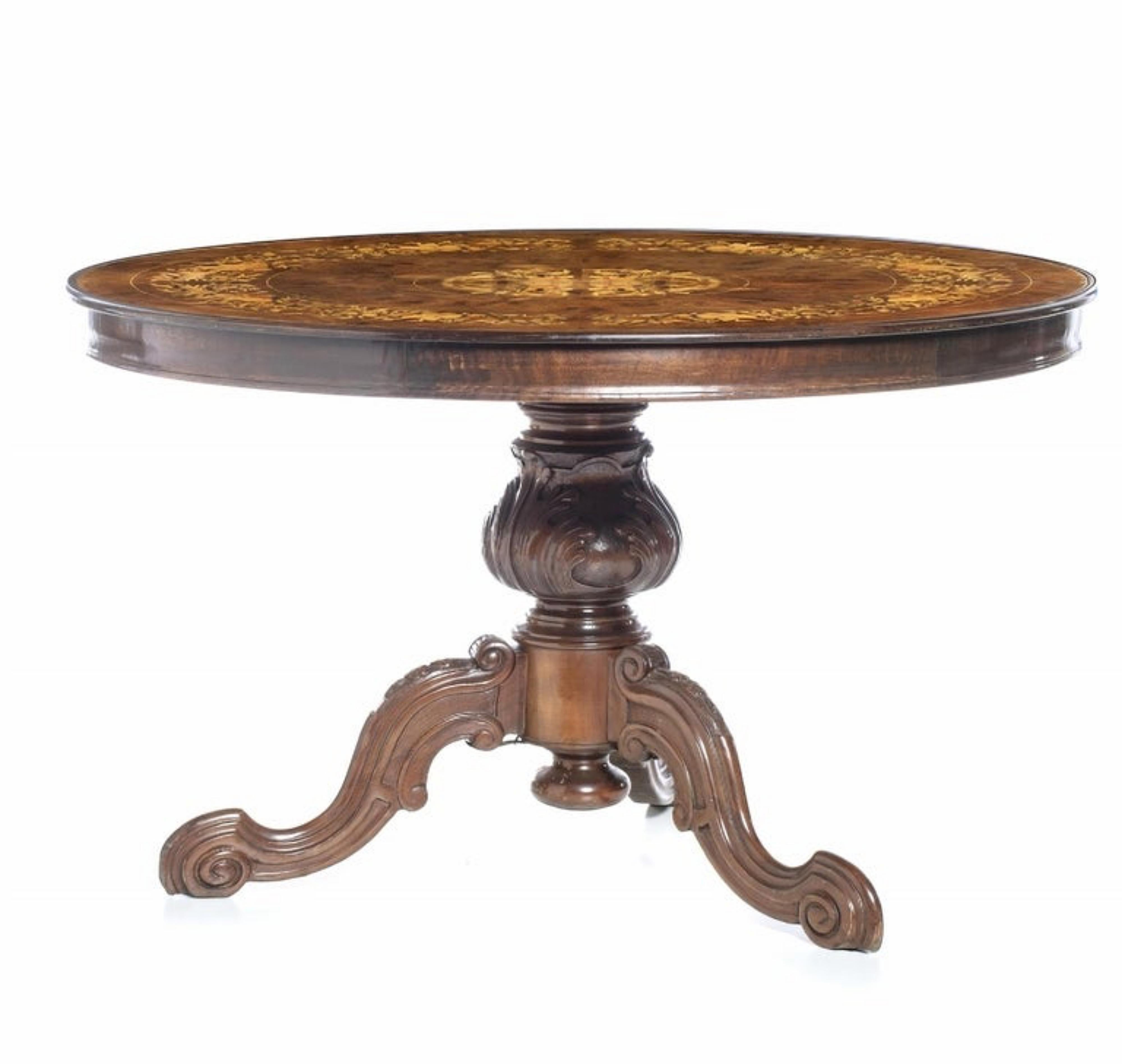 Center table
Portuguese,
19th century
In mahogany and satin wood. 
Round top decorated with 