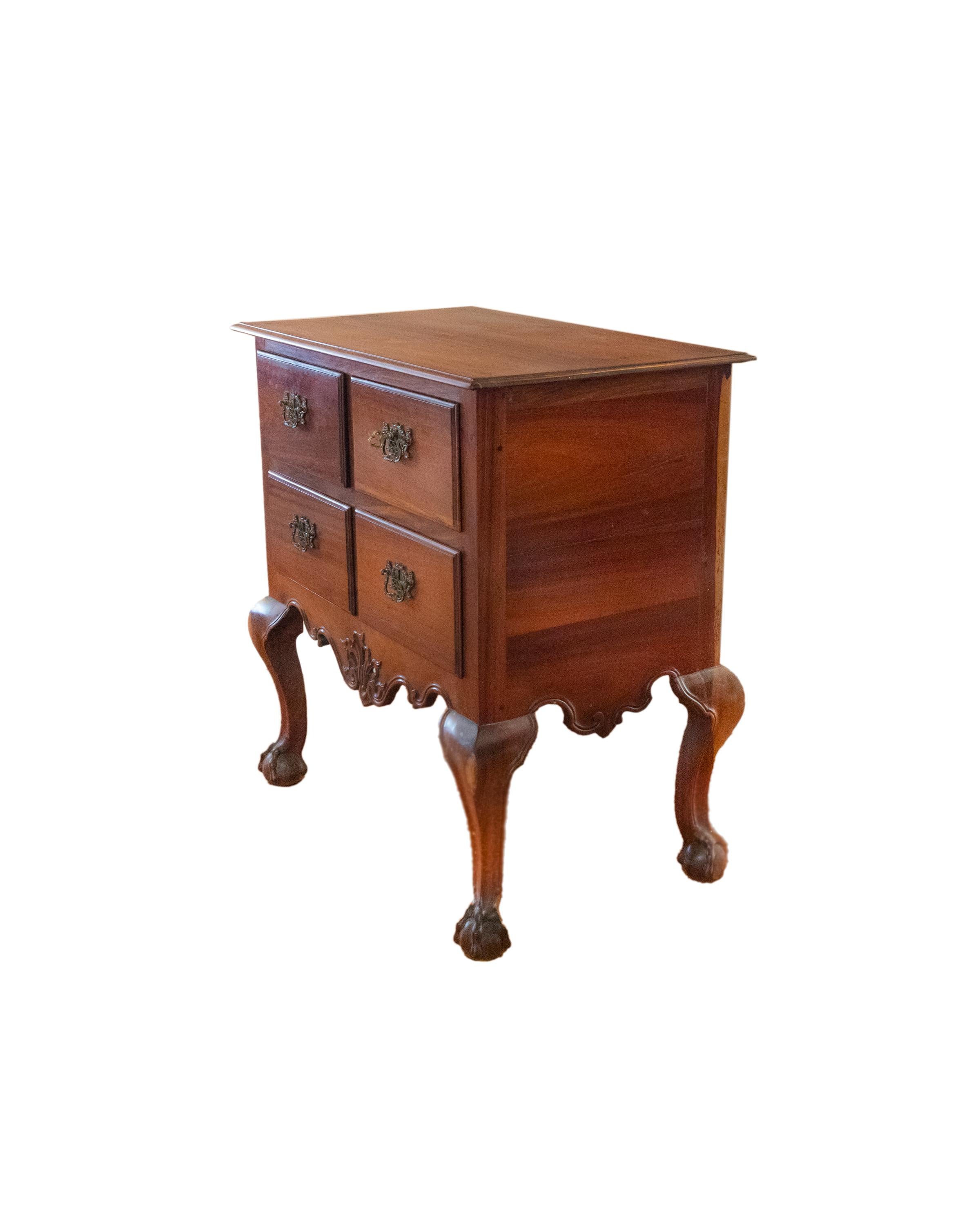 This rare 19th century chest of drawers features a cabriolet skirt and legs, three drawers, and period-appropriate drawing board and metal hardware. It showcases an English-influenced style that was popular during the reign of Maria the I of