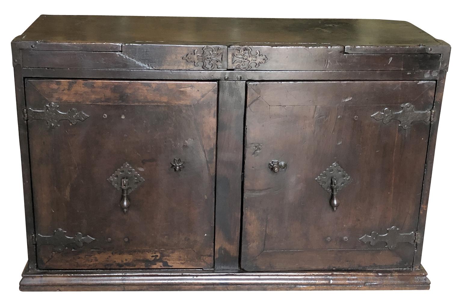 A very handsome early 18th century Sacrestia buffet from Portugal. Beautifully constructed from walnut with handsome iron fittings. The cabinet has an excellent patina. Nice narrow depth.