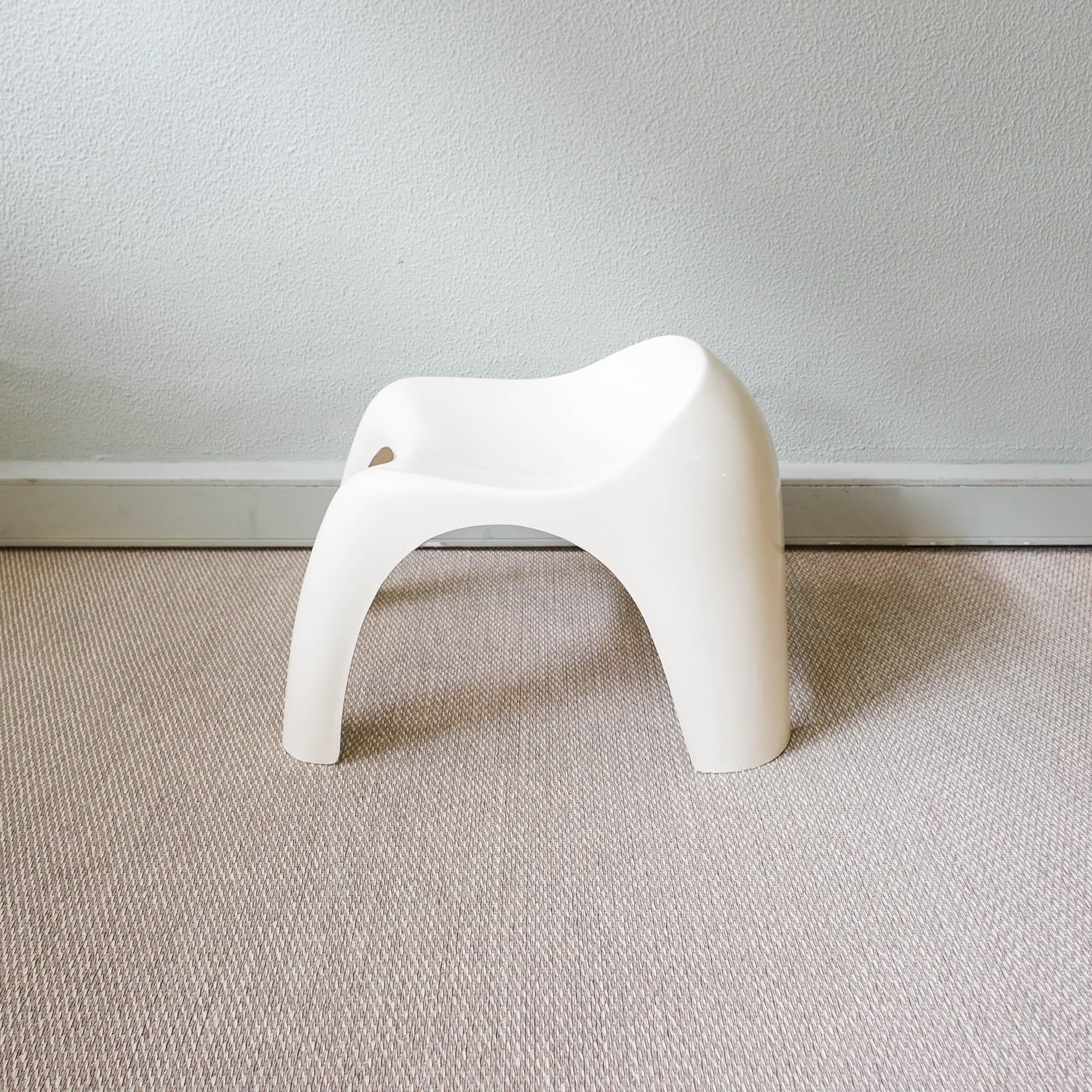 This stool was designed and produced in Portugal, during the 1970's, in the style of Efebino stool by Stacy Dukes for Artemide. It is made of white fiberglass and it is in original and good vintage condition.