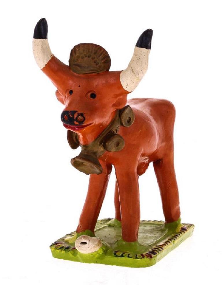 Portuguese Folk Art terracotta hand painted polychrome cow whistle by Ana Baraça (1904-2001), used as a Christmas Nativity Scene figurine.

Ana Baraça still is an important artistic reference of the Portuguese Handicrafts today.