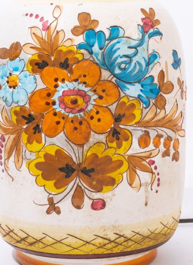 Portuguese glazed ceramic table lamp enhanced with floral motif on both sides.