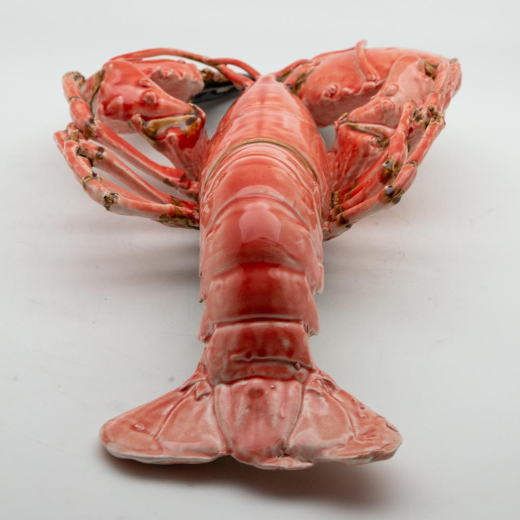 Portuguese handmade Pallissy or Majolica large coral lobster.

Ceramic sea life art has long been a tradition in Portugal. It was inspired by the 